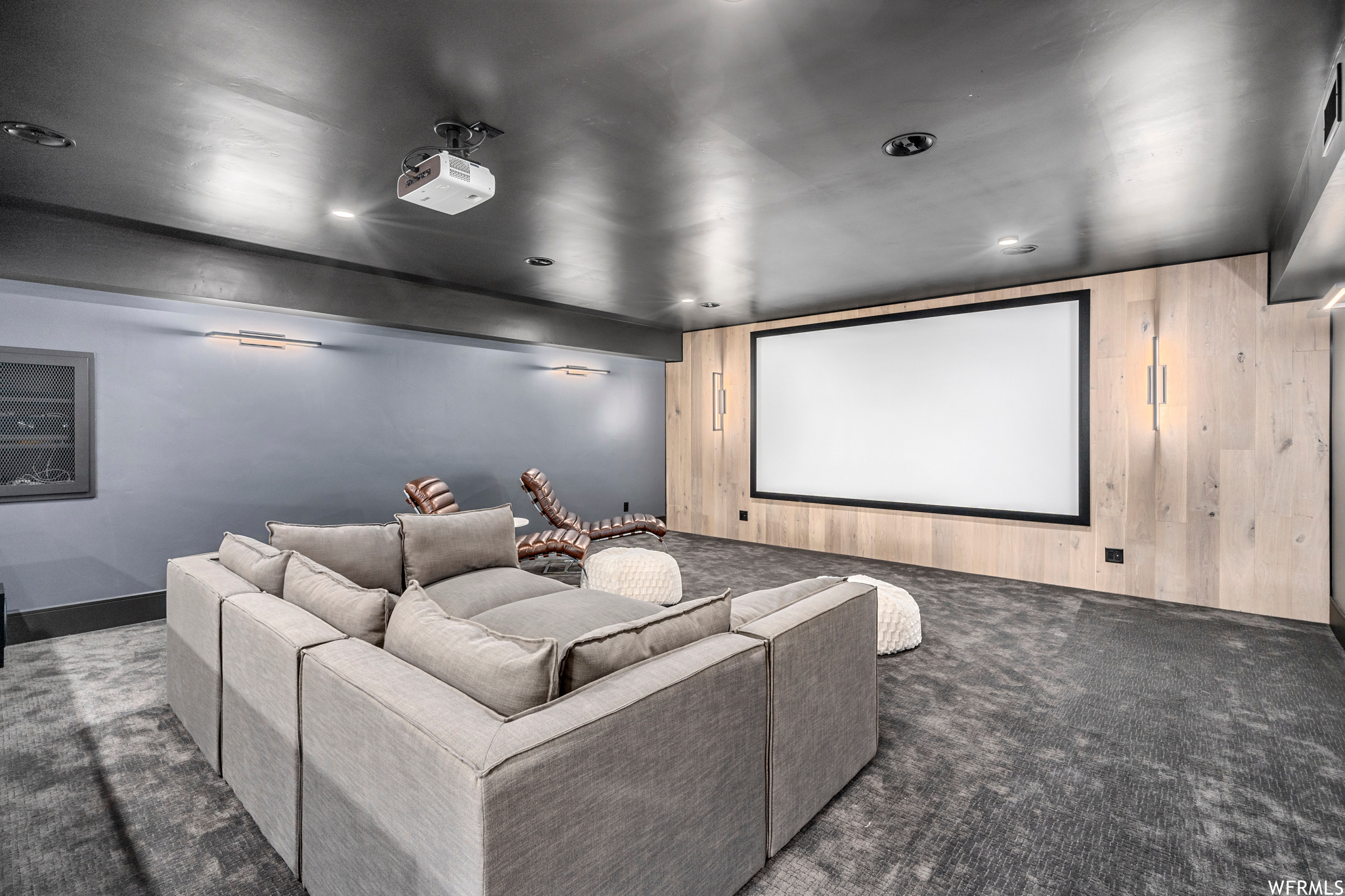 Finished theater room with a cozy spot for everyone