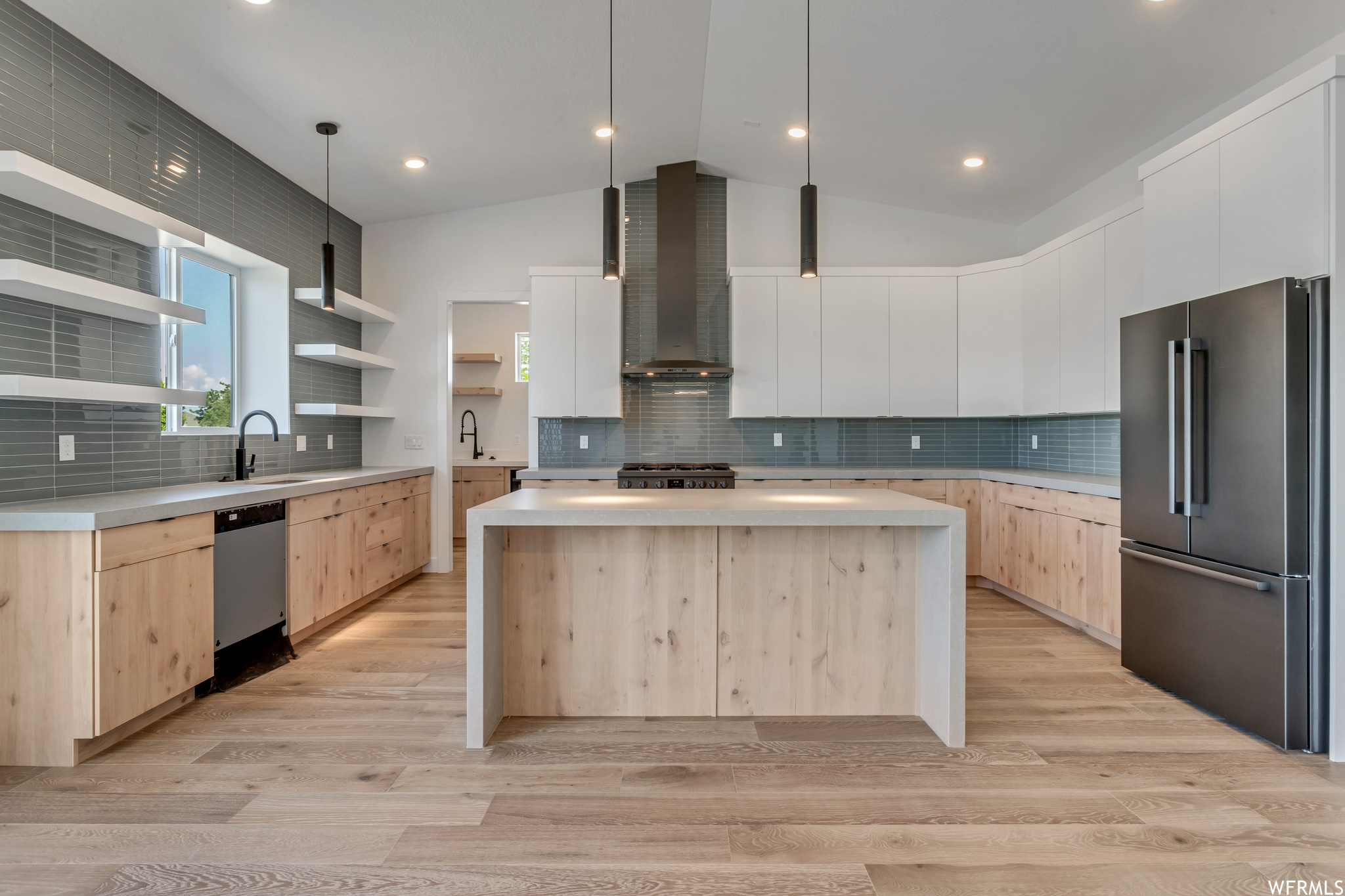 The backsplash tile and dark stainless appliances make this kitchen unique