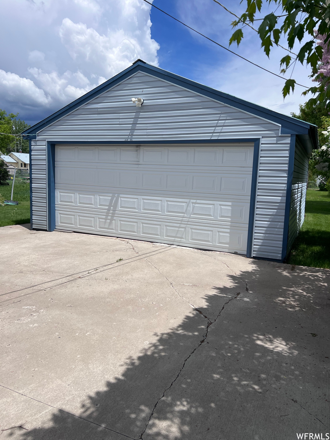 Garage featuring a yard