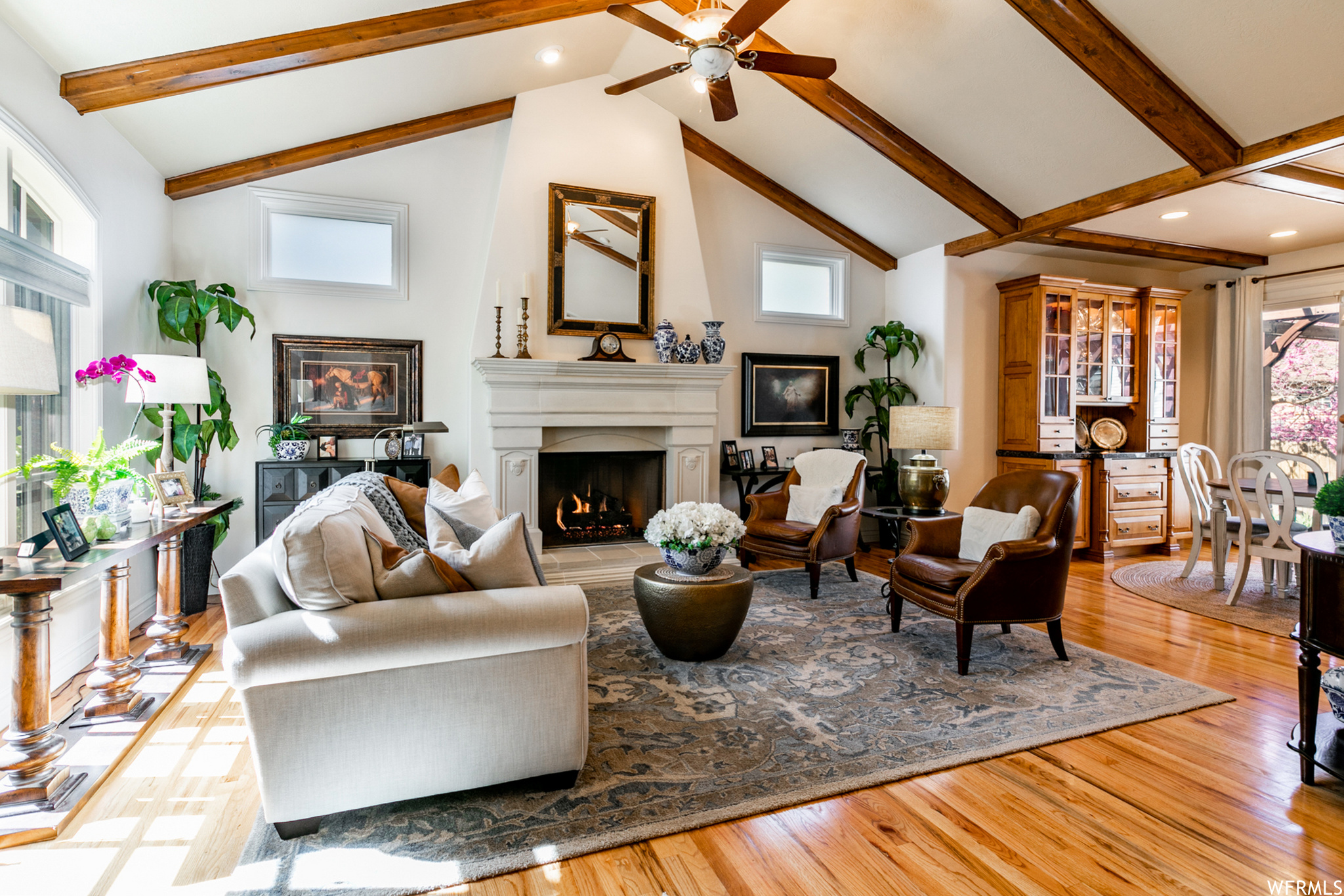 Enter through an arched entry to this wonderful room with richly crafted details. An elegant fireplace includes a gas log.
