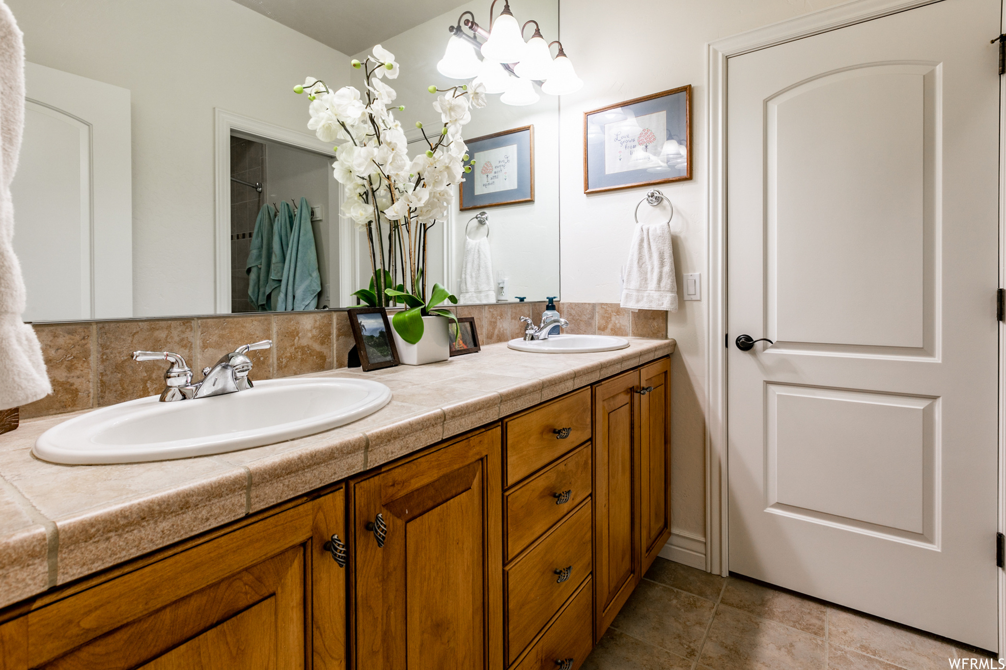 A Jack & Jill bath sits between the two upstairs bedrooms and includes a double vanity.