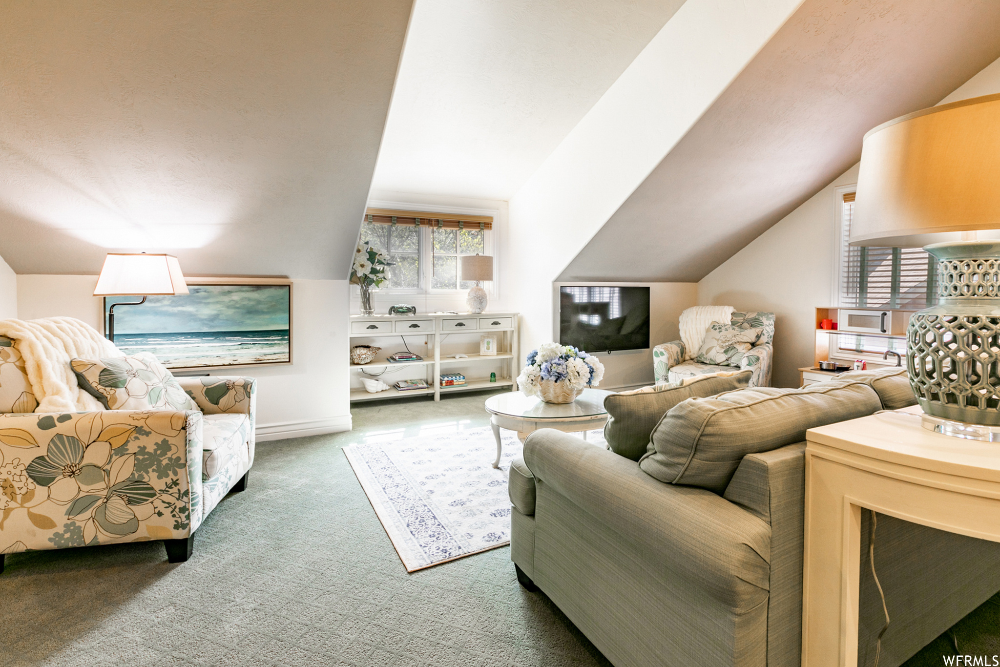 Opening on one side to the main level this large space, with views of the mountains, could be used as a family area or an office.