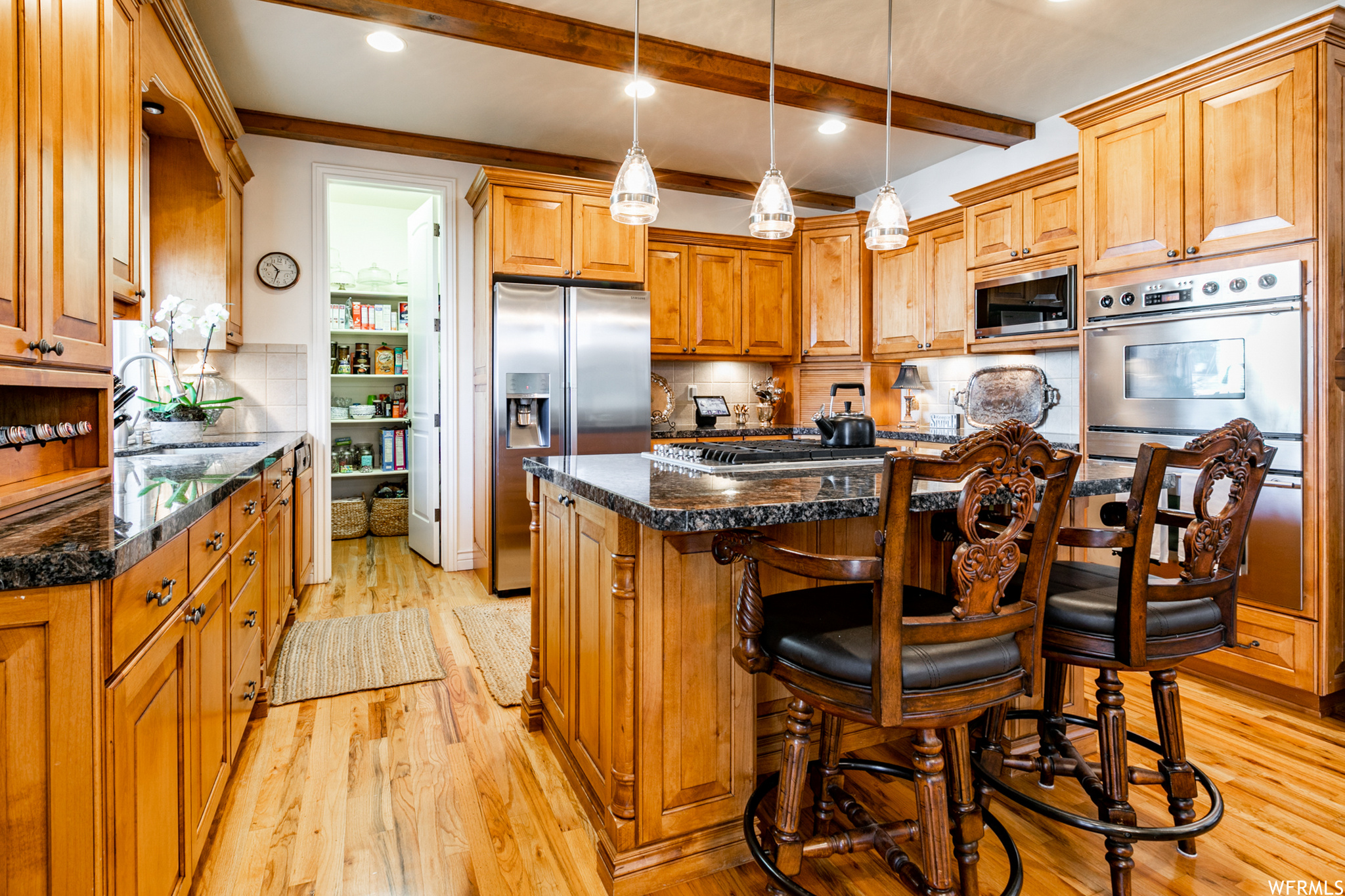 New microwave and newer side x side stainless refrigerator as well as a wine rack and 2 corner lazy-Susan cabinets are included