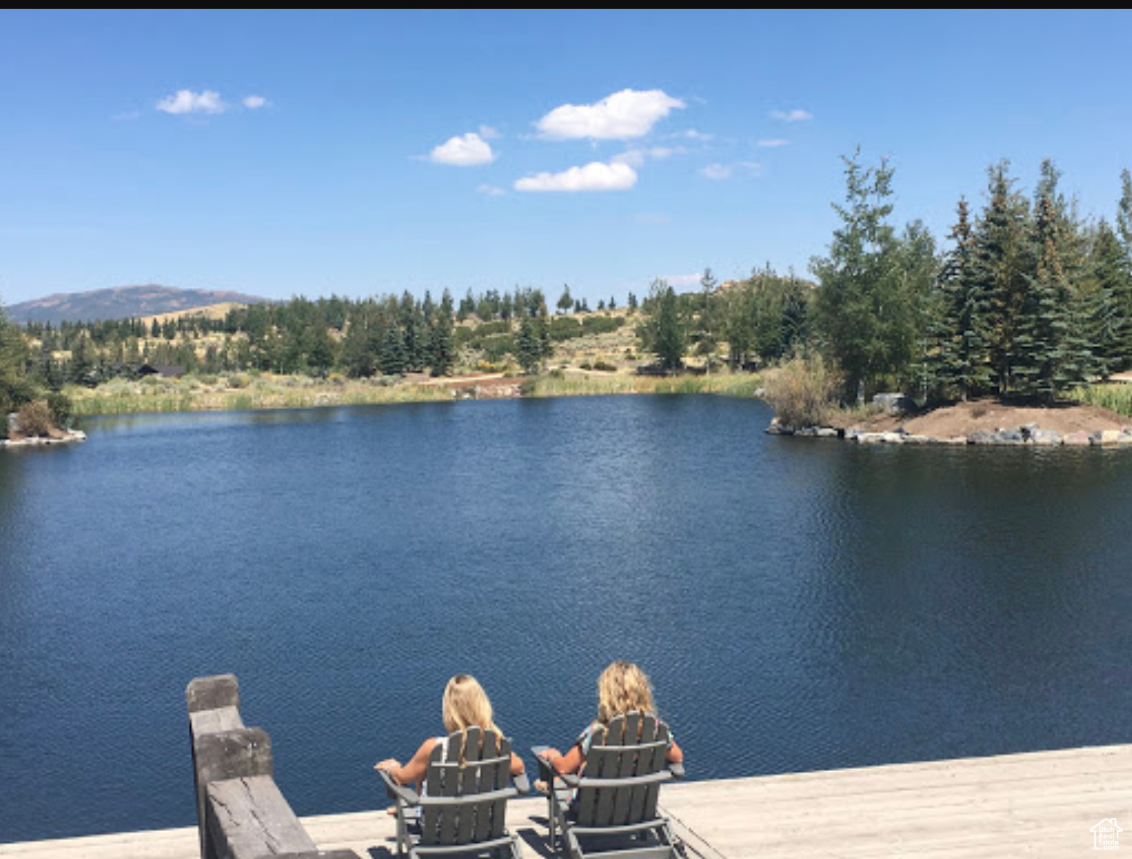 The Boat House stands as the centerpiece of Mountain Garden Park, a picturesque cabin nestled along the shores of Mountain Garden Pond.