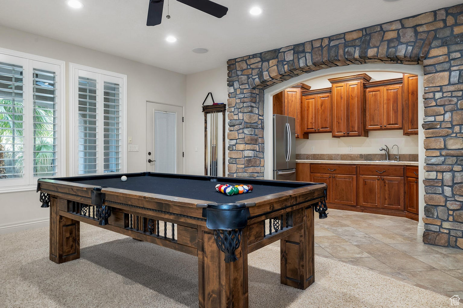 Playroom with sink, billiards, ceiling fan, and light tile floors