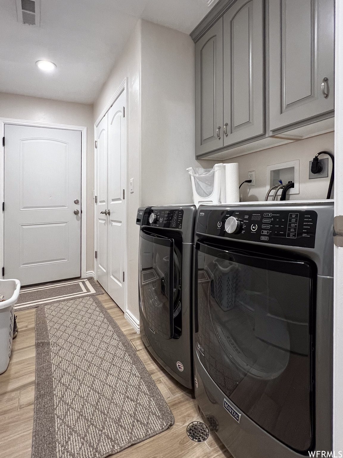 Washroom featuring separate washer and dryer
