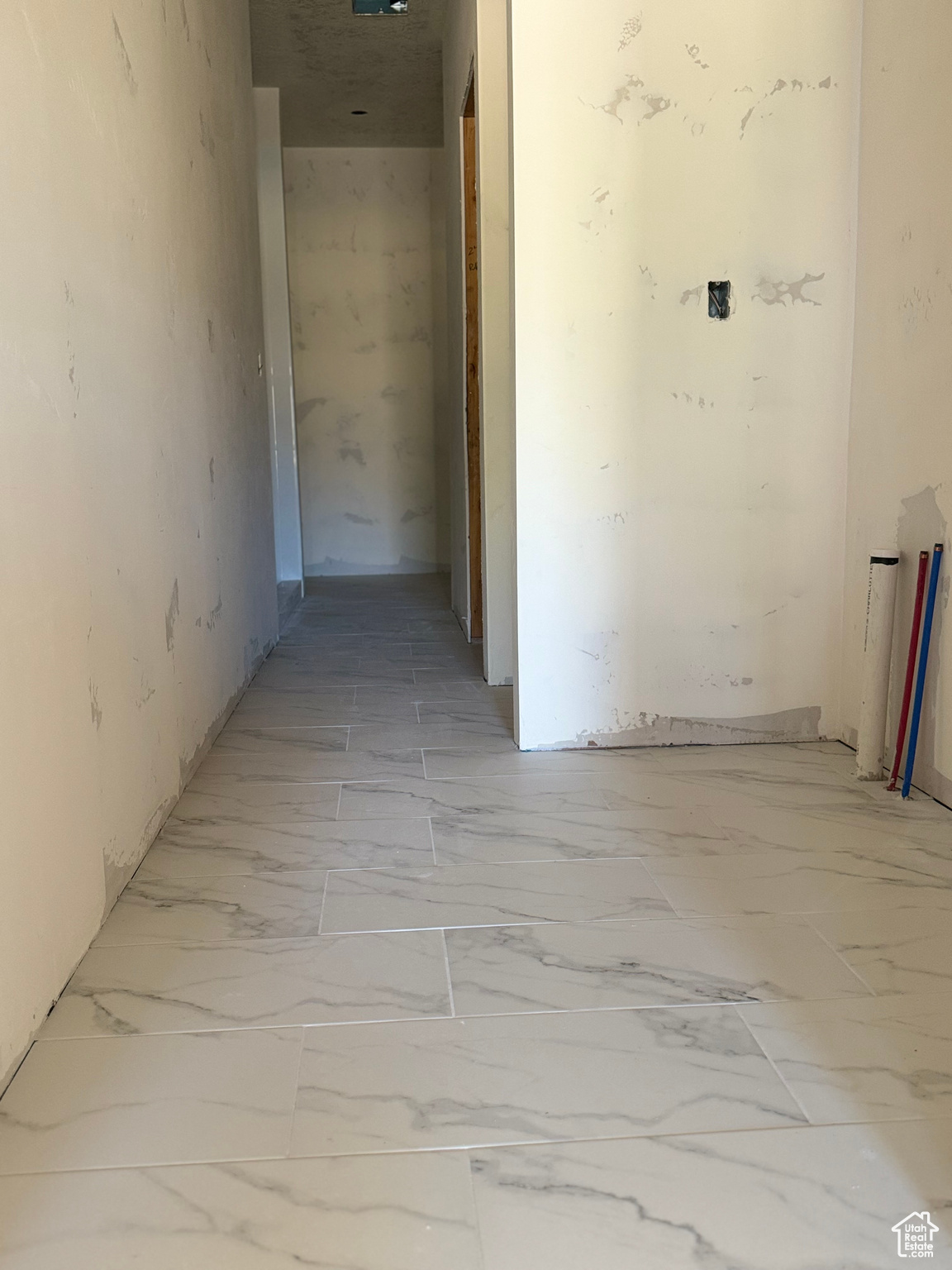 PRIMARY ENSUITE BATHROOM Corridor with light tile patterned floors