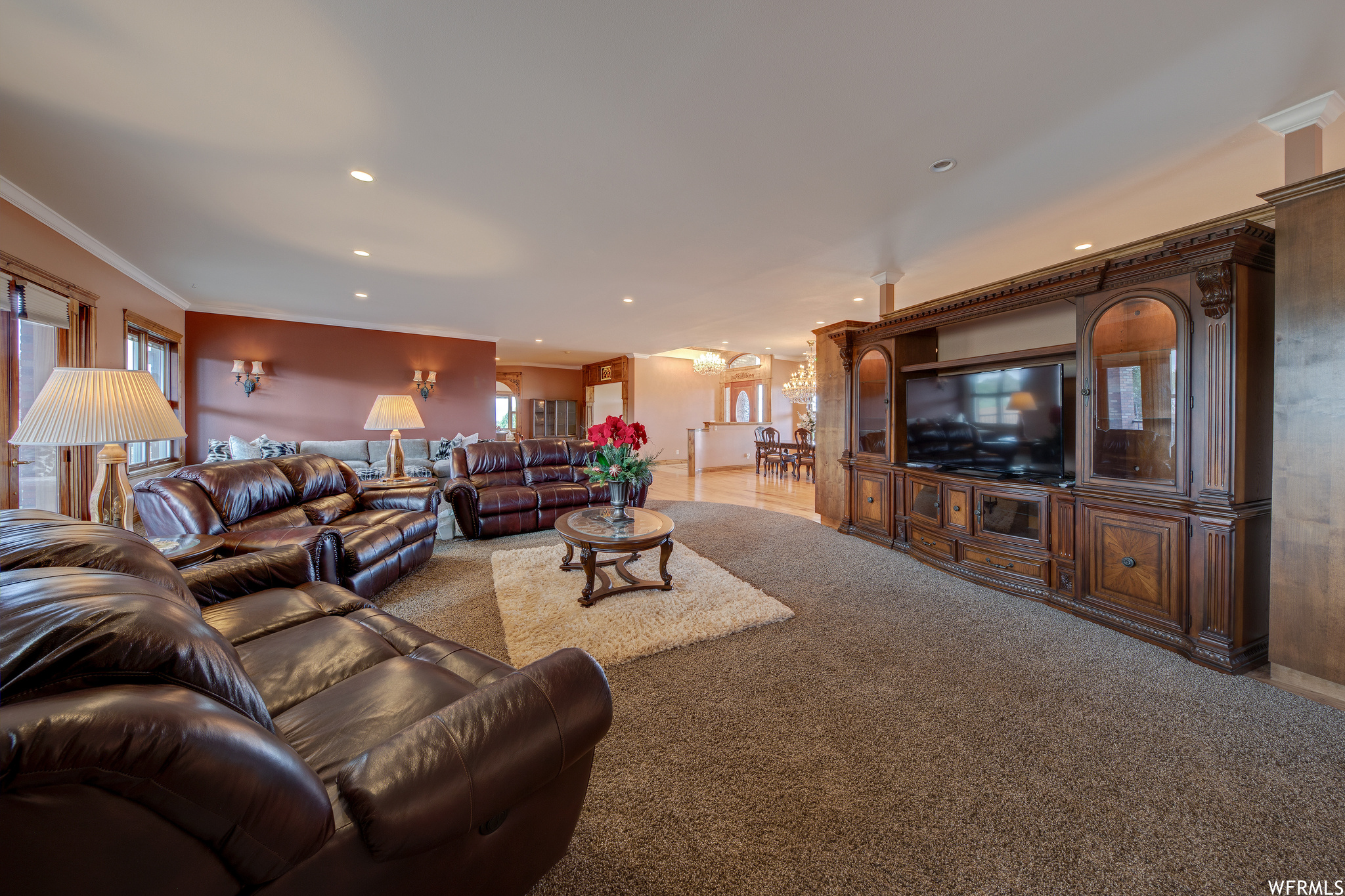 Carpeted living room featuring TV