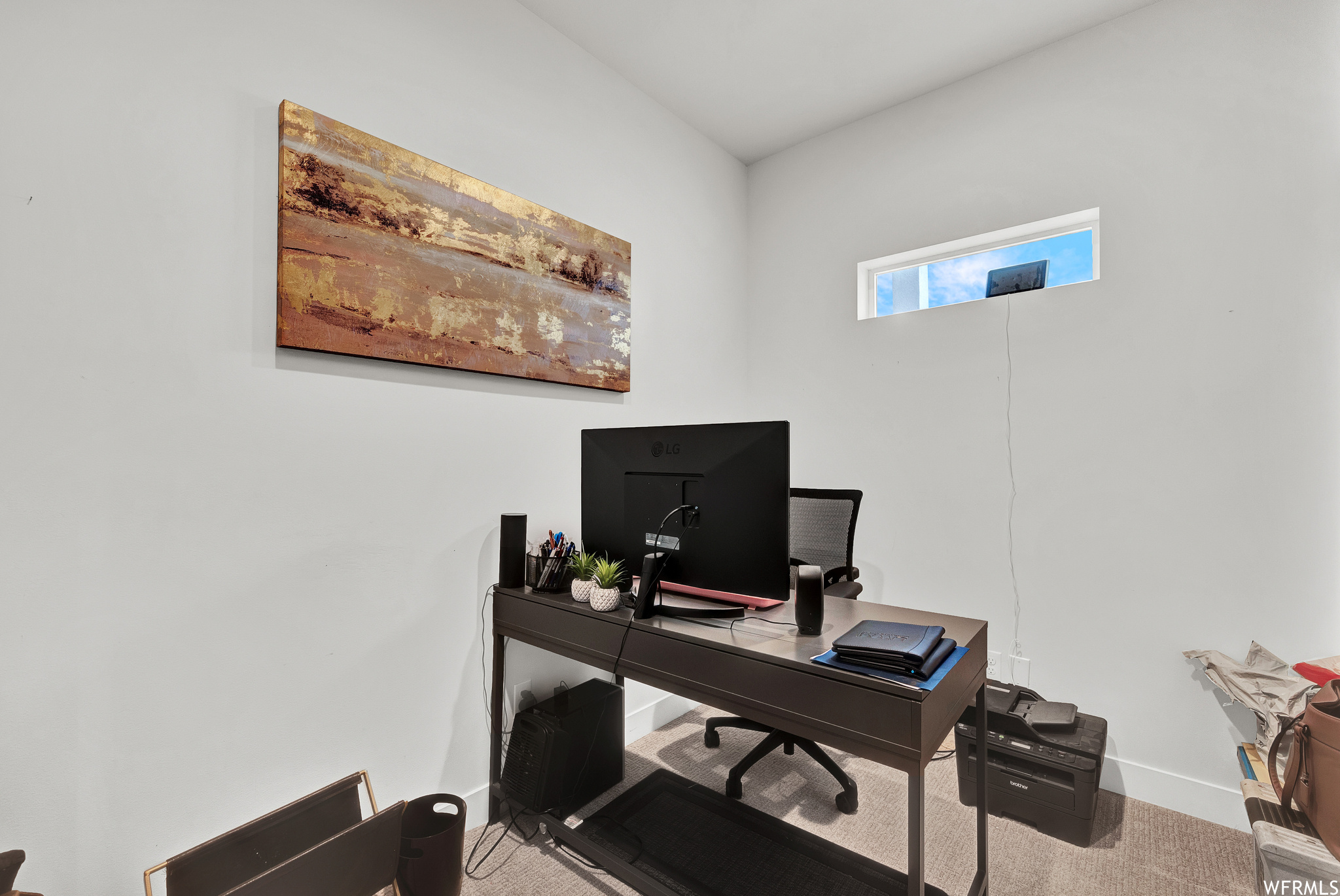 Office with natural light and TV