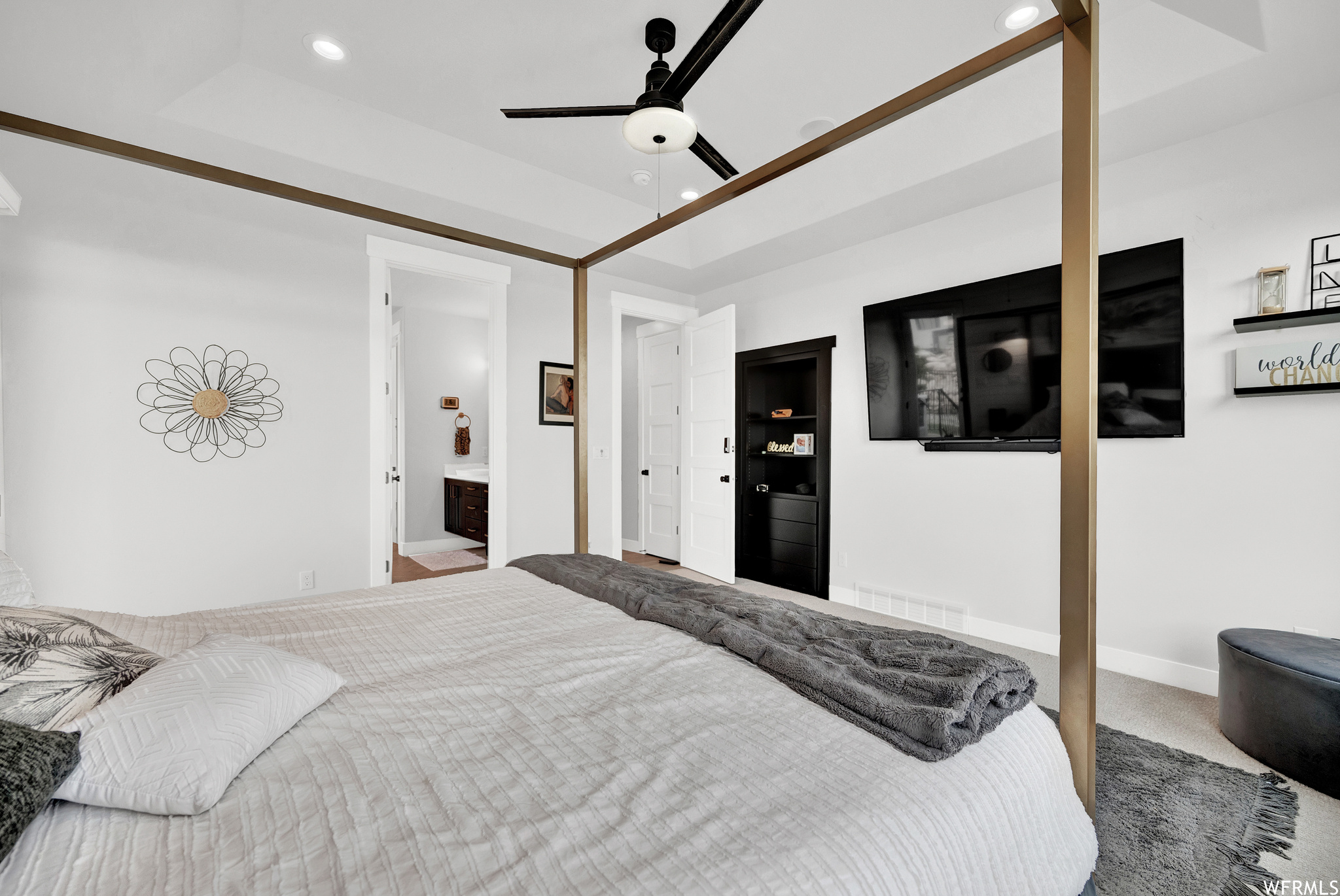Bedroom featuring a ceiling fan, carpet, and TV