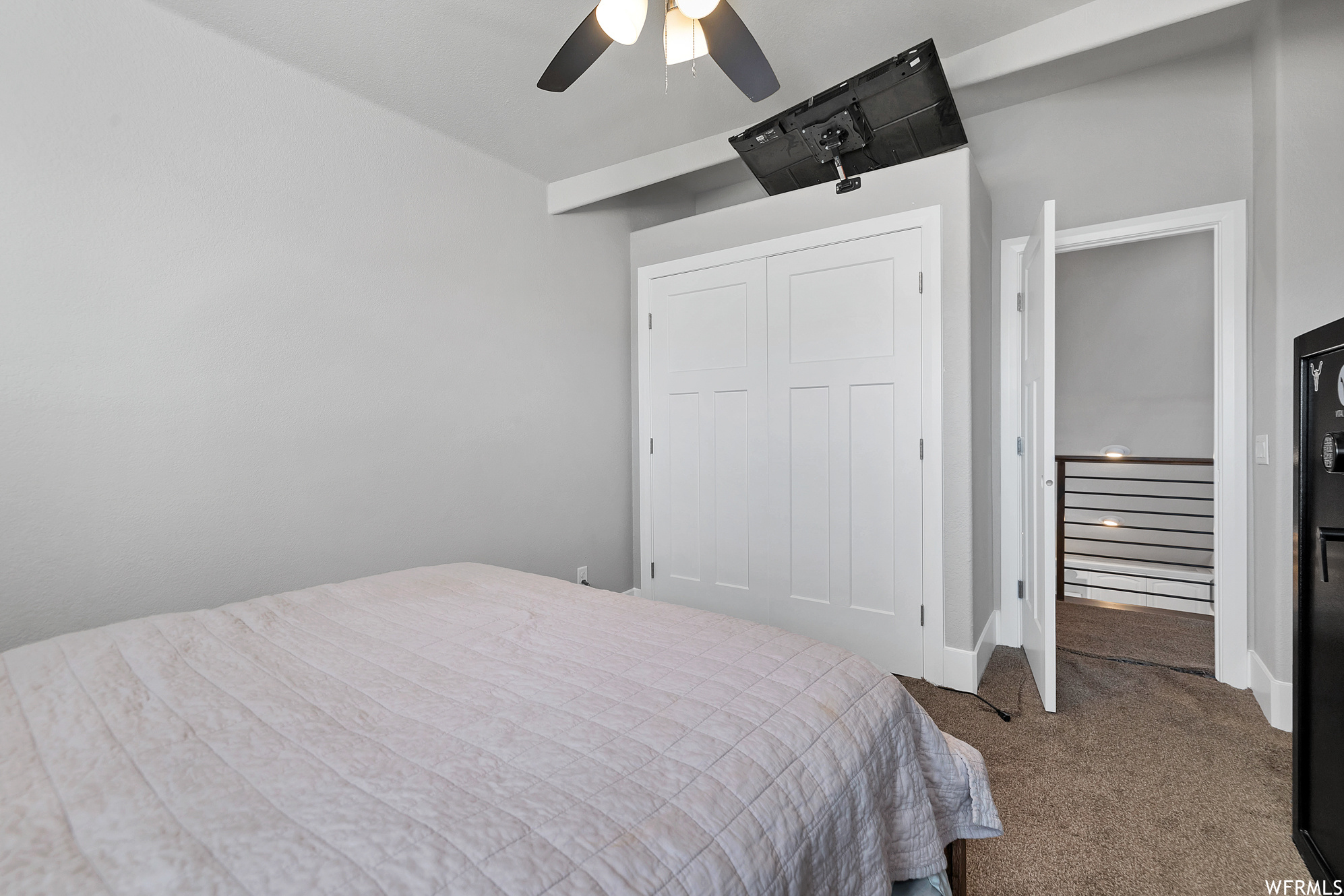 Bedroom featuring carpet and a ceiling fan