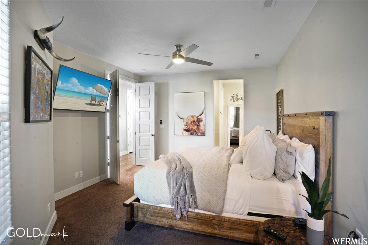 Bedroom featuring a ceiling fan and TV