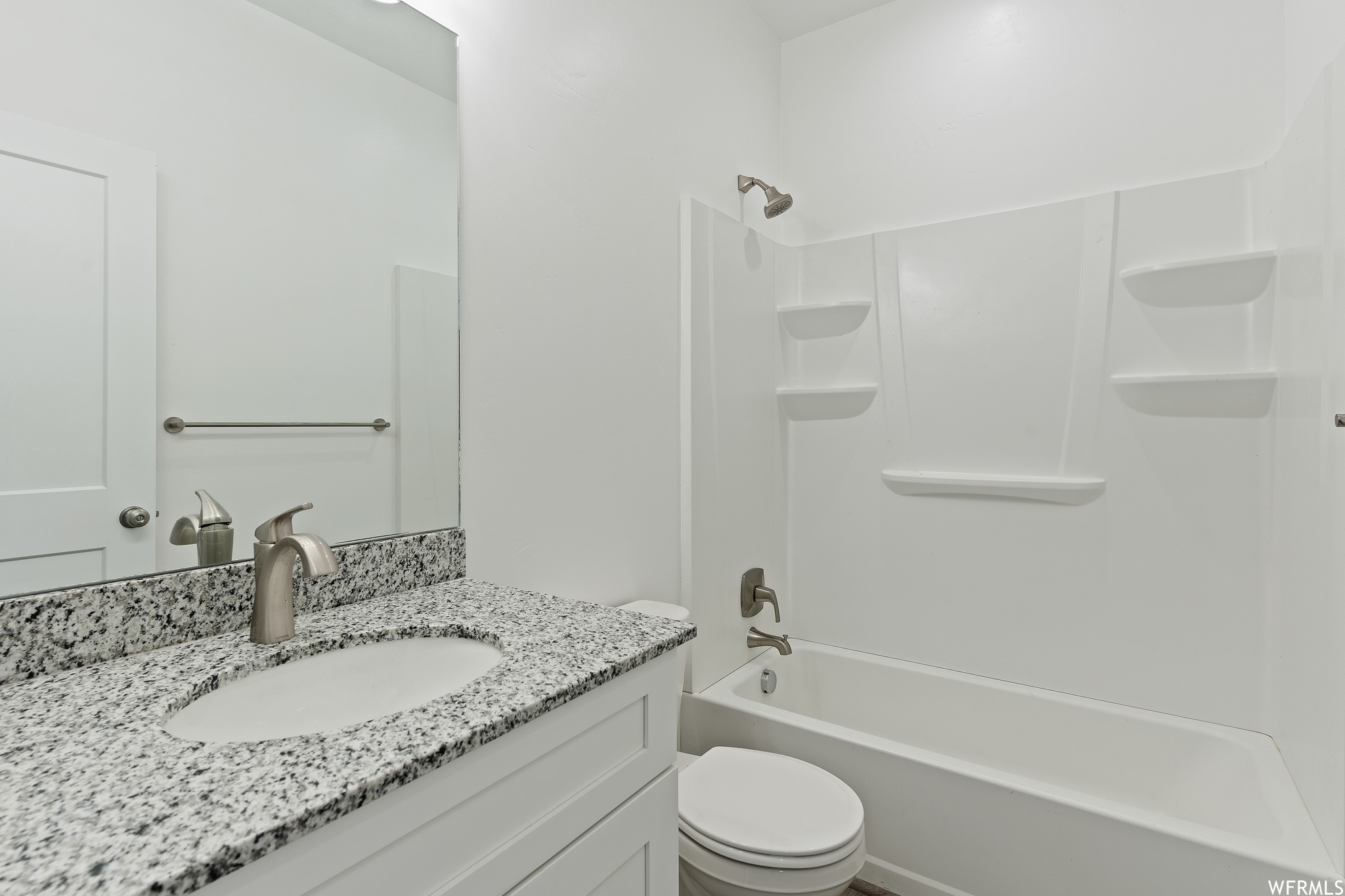 Full bathroom with vanity, mirror, and  shower combination