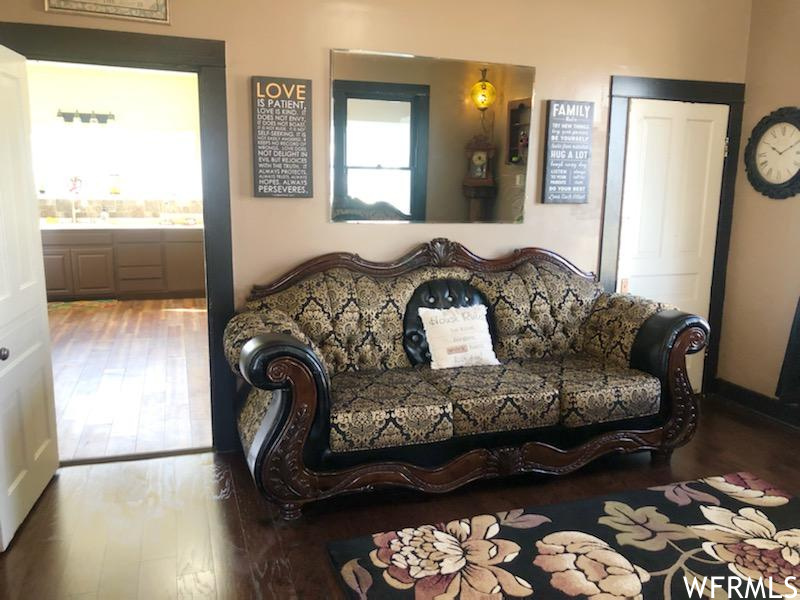 Living room featuring dark hardwood / wood-style flooring