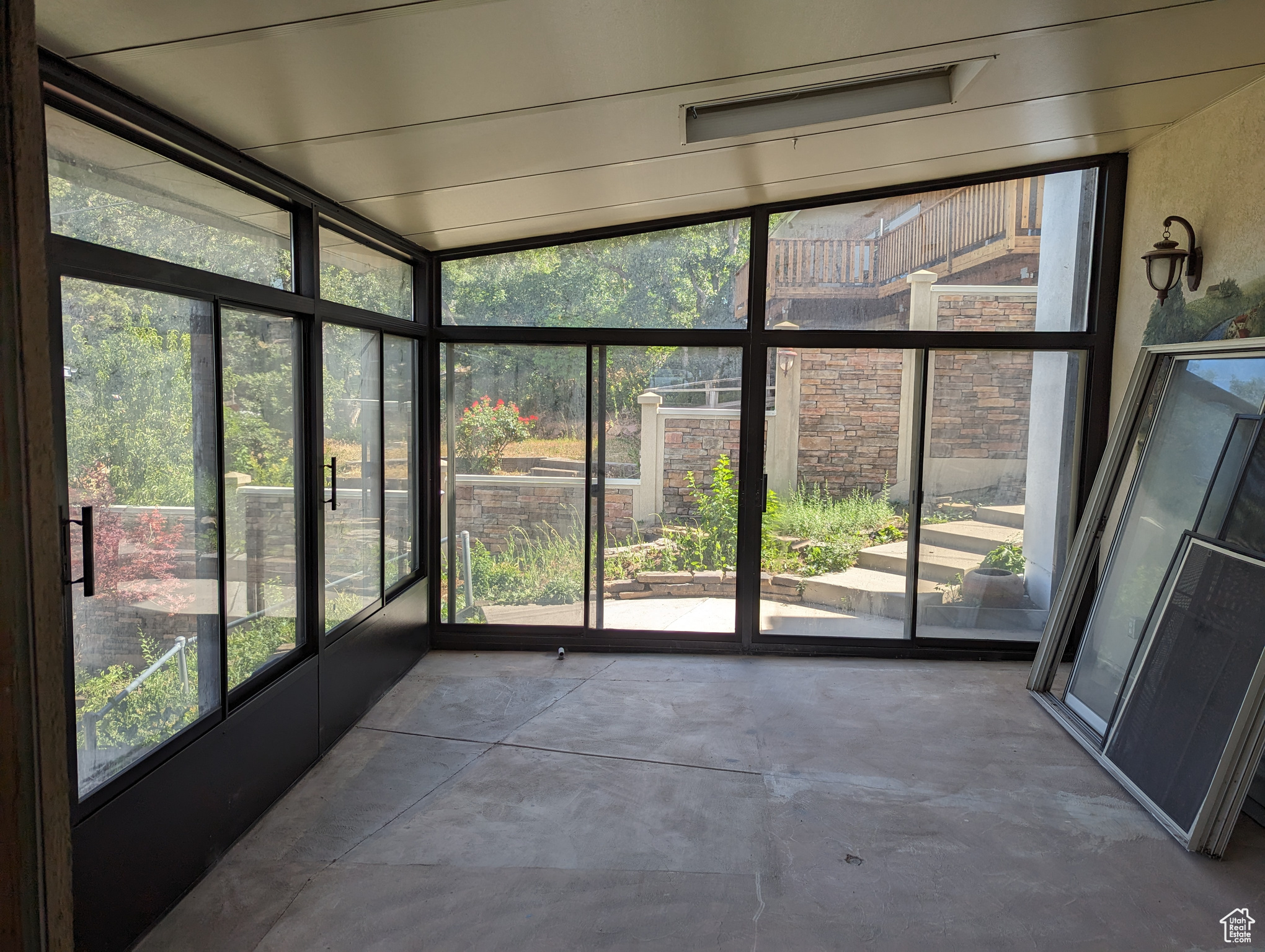 Unfurnished sunroom with a healthy amount of sunlight