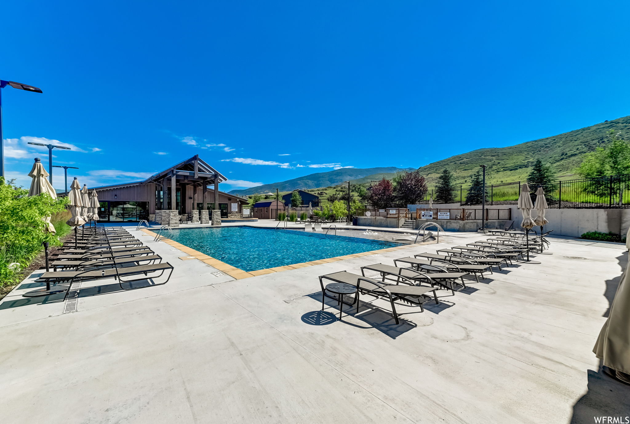 View of swimming pool featuring a patio area and a mountain view