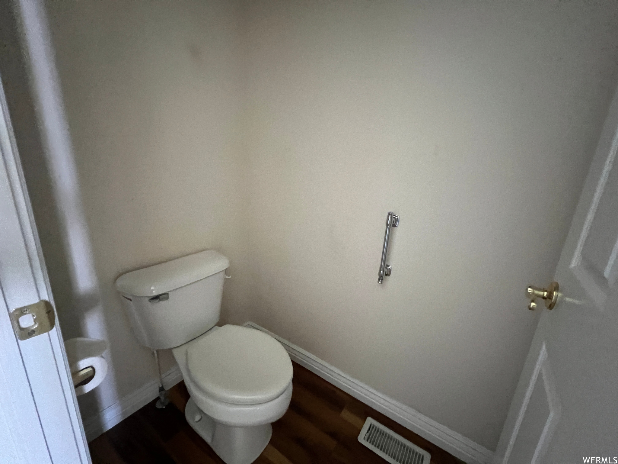 Bathroom with dark hardwood floors