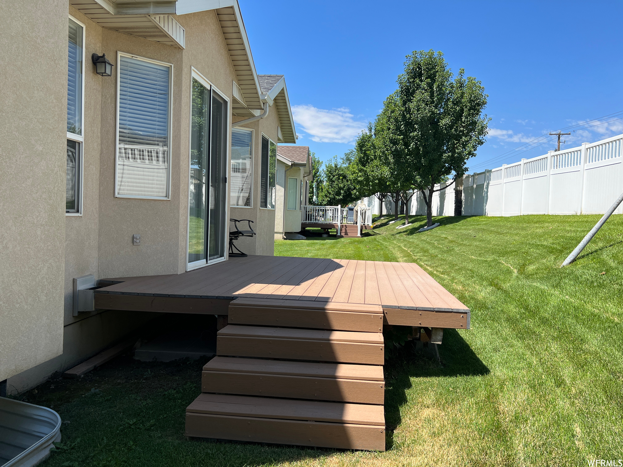 View of yard featuring a deck