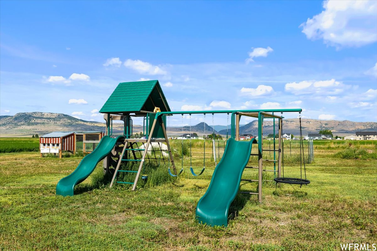 View of playground with a mountain view