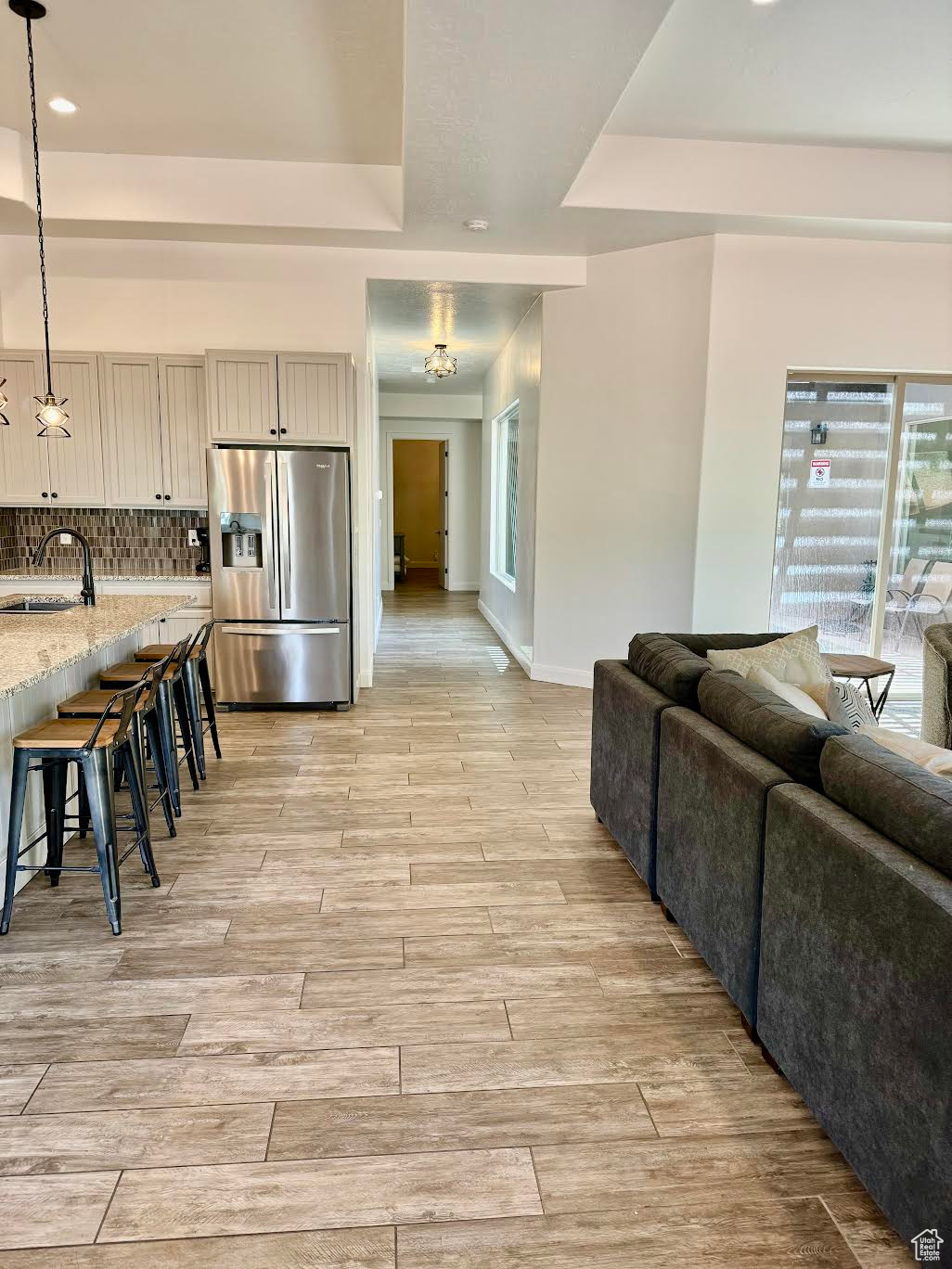 Interior space featuring sink, a wealth of natural light, and a tray ceiling