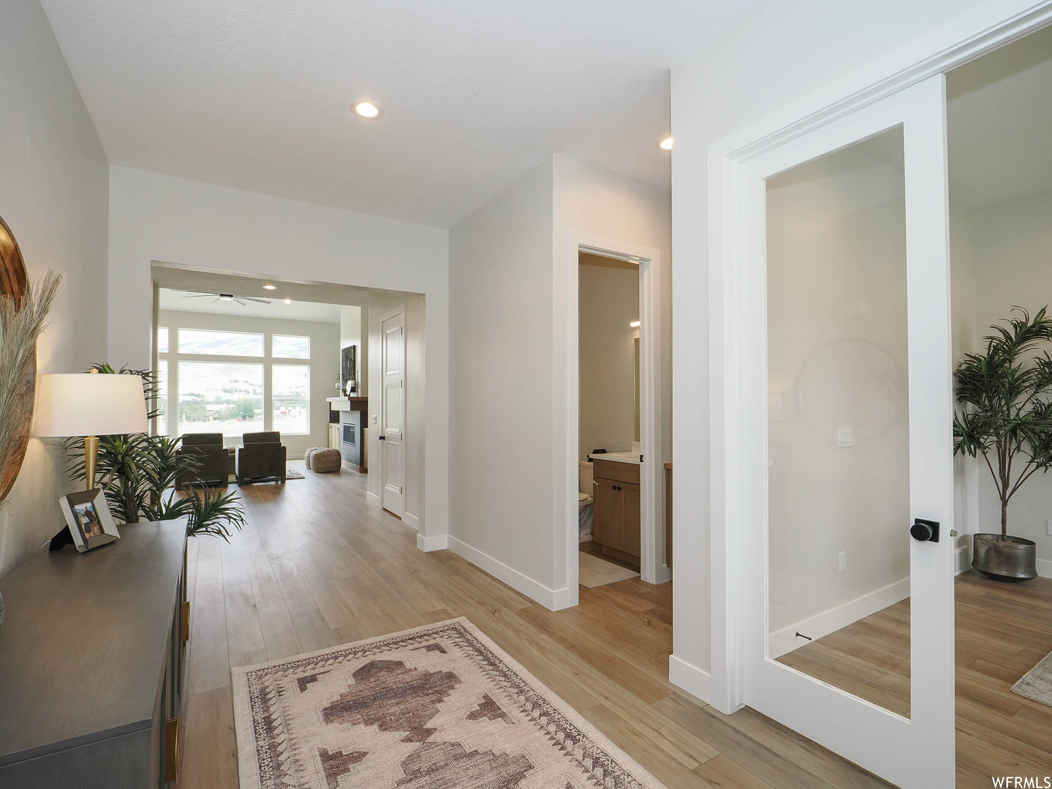 Corridor featuring light hardwood flooring