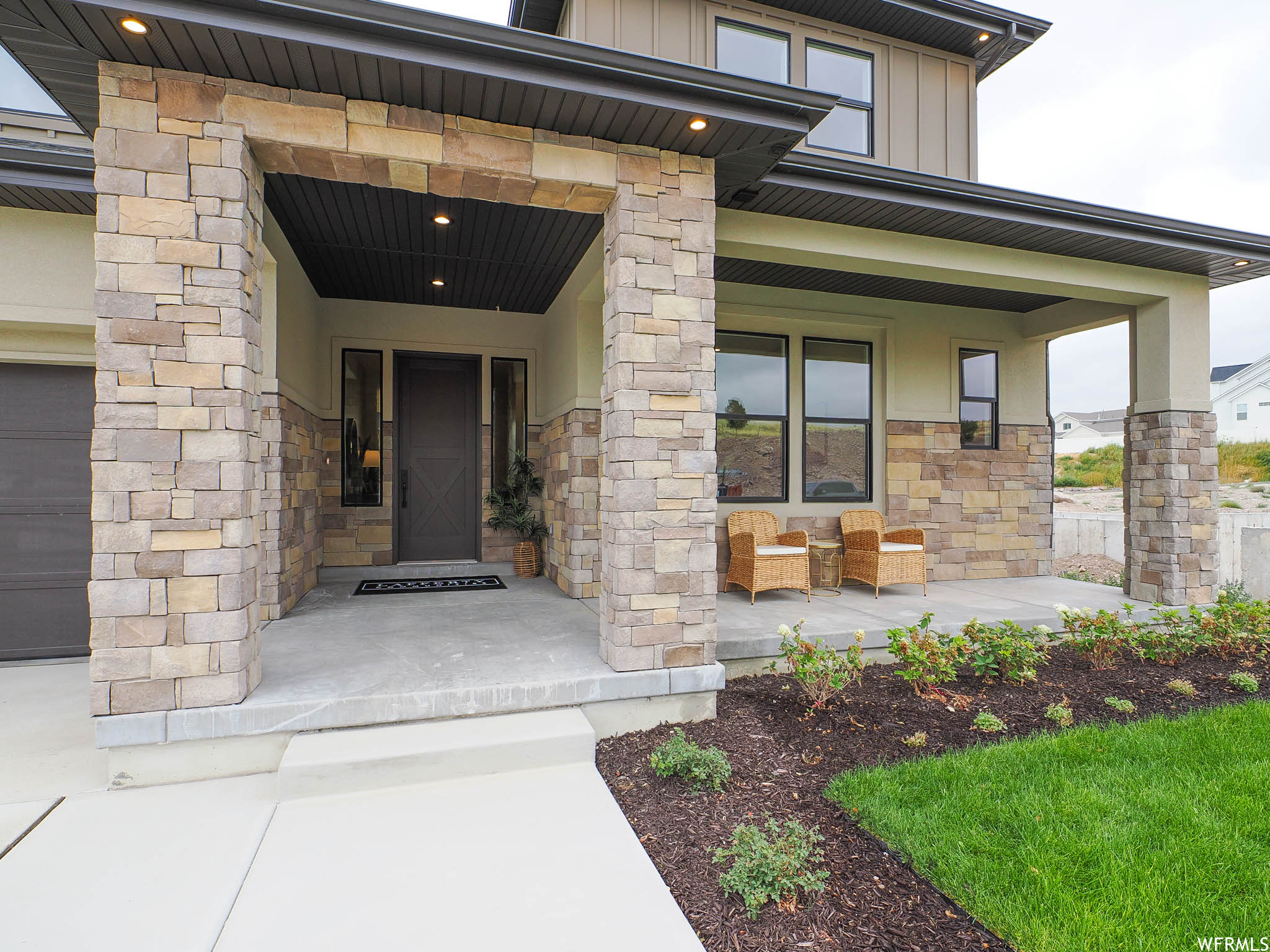 Entrance to property featuring a porch