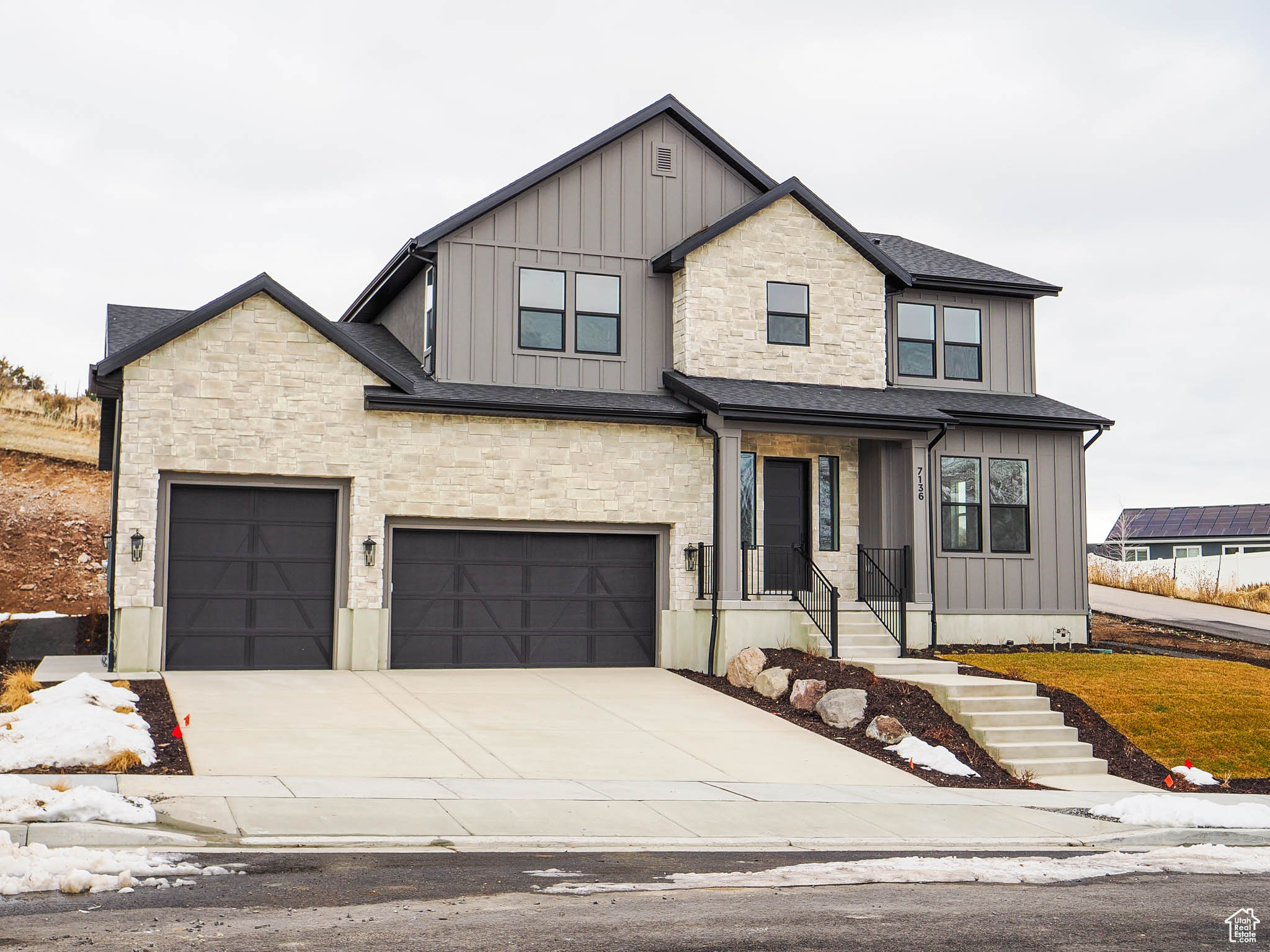 View of front of home featuring a garage