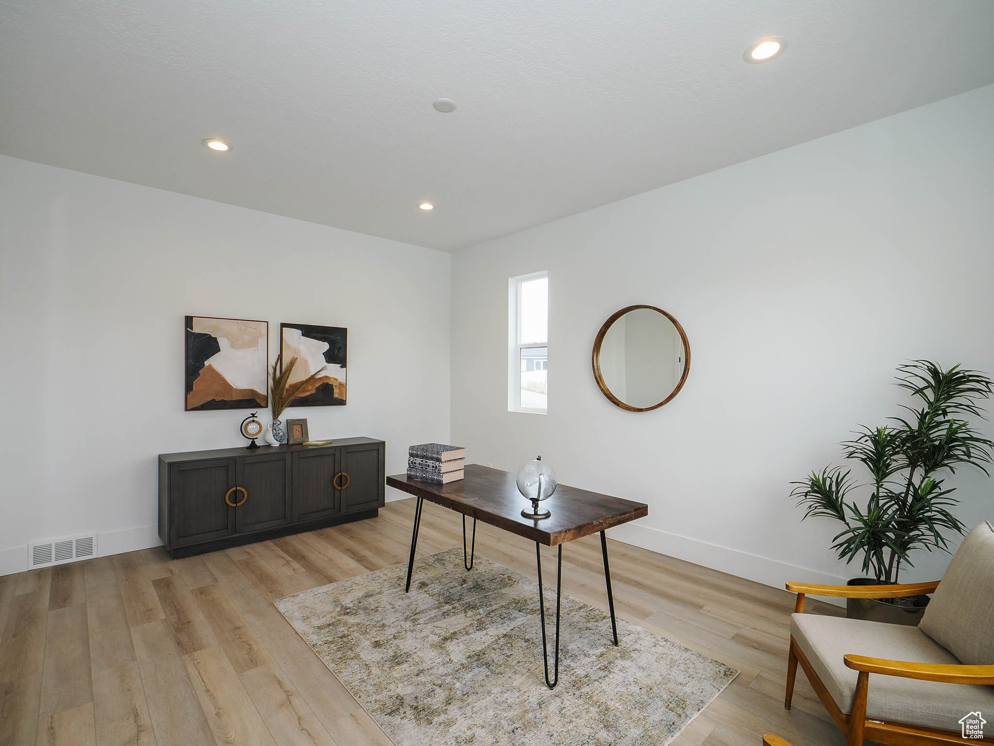 Office space featuring light hardwood / wood-style floors