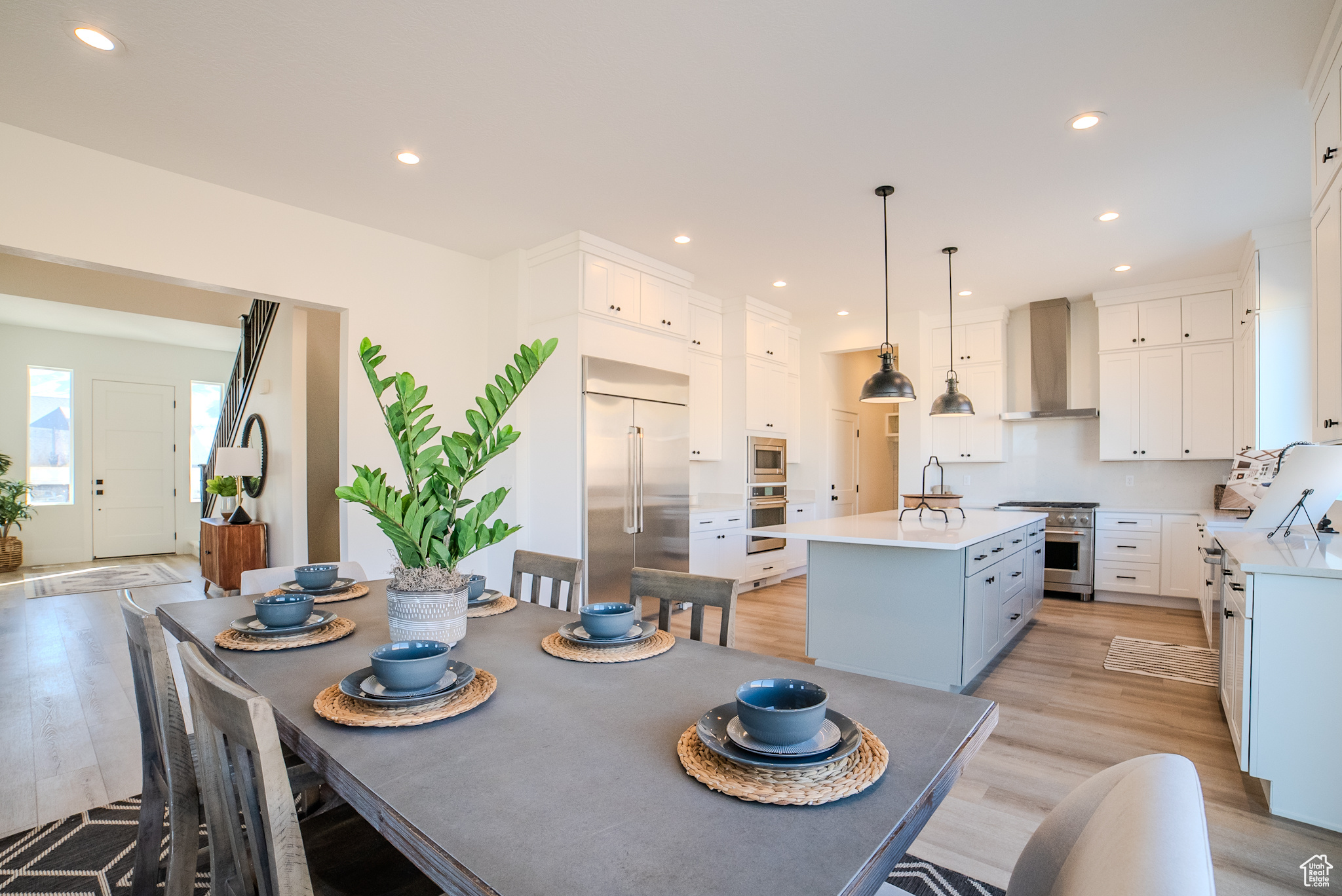 Dining room with sink and light hardwood / wood-style flooring