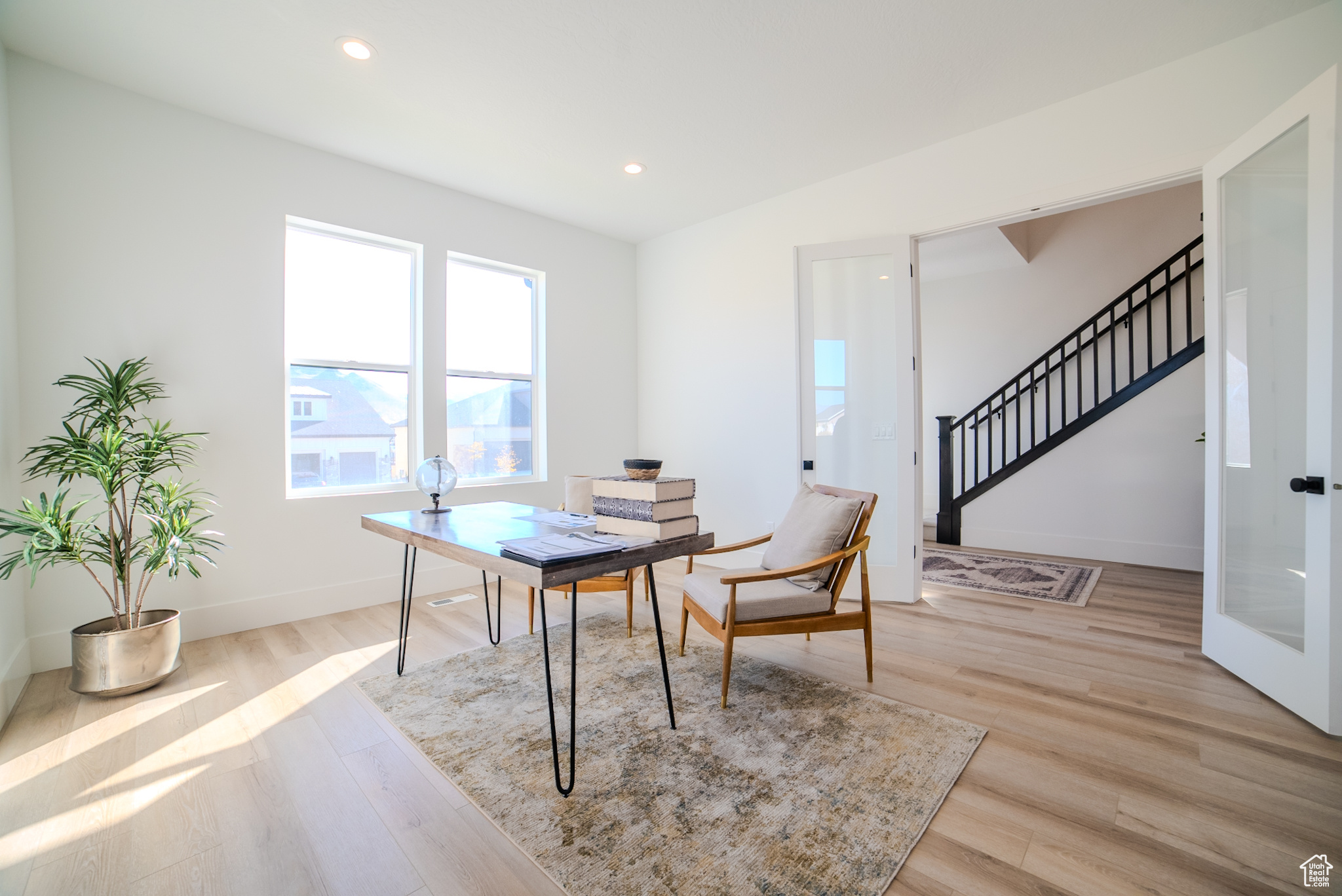 Office area featuring light hardwood / wood-style floors