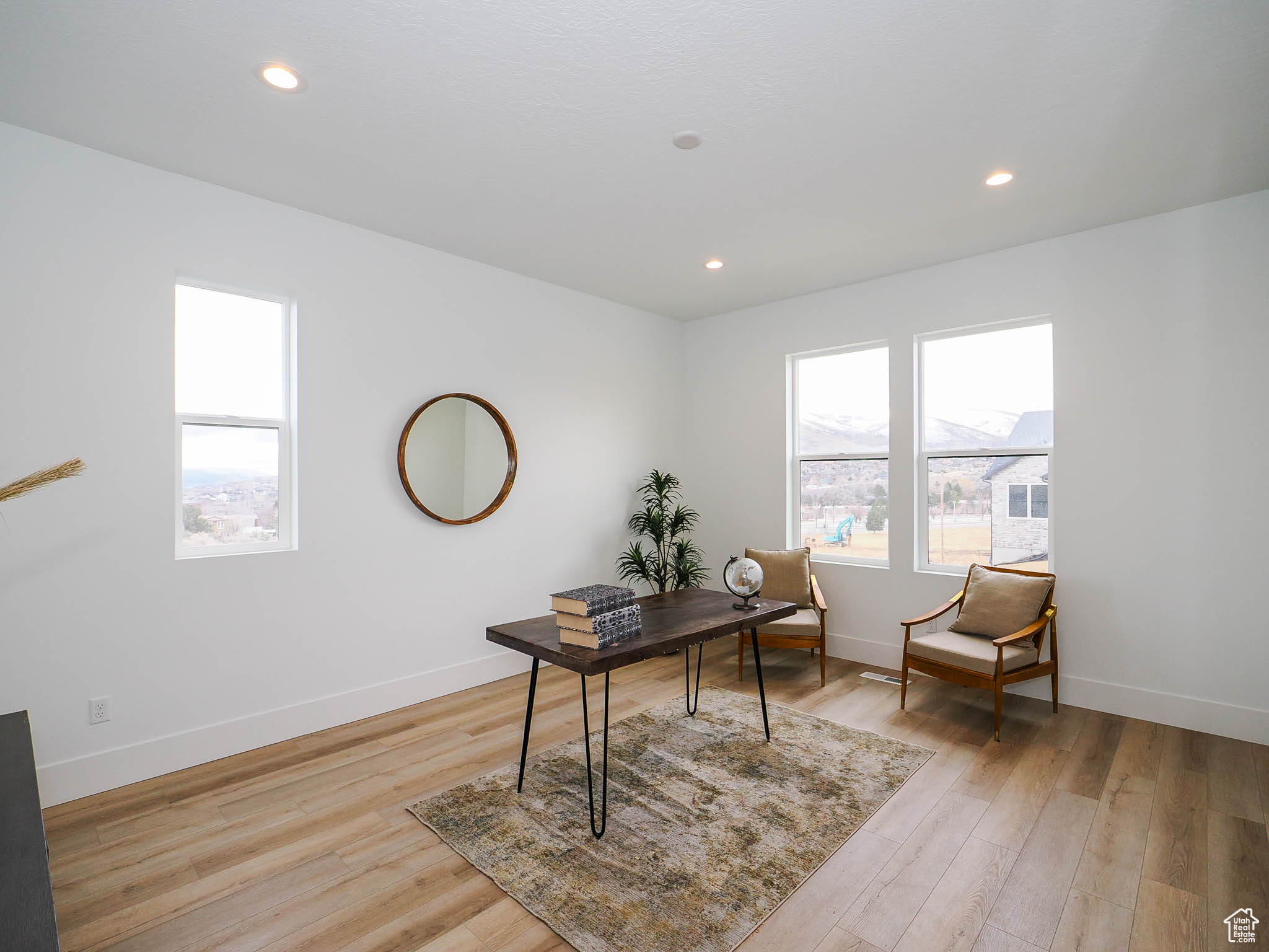 Office space featuring light wood-type flooring