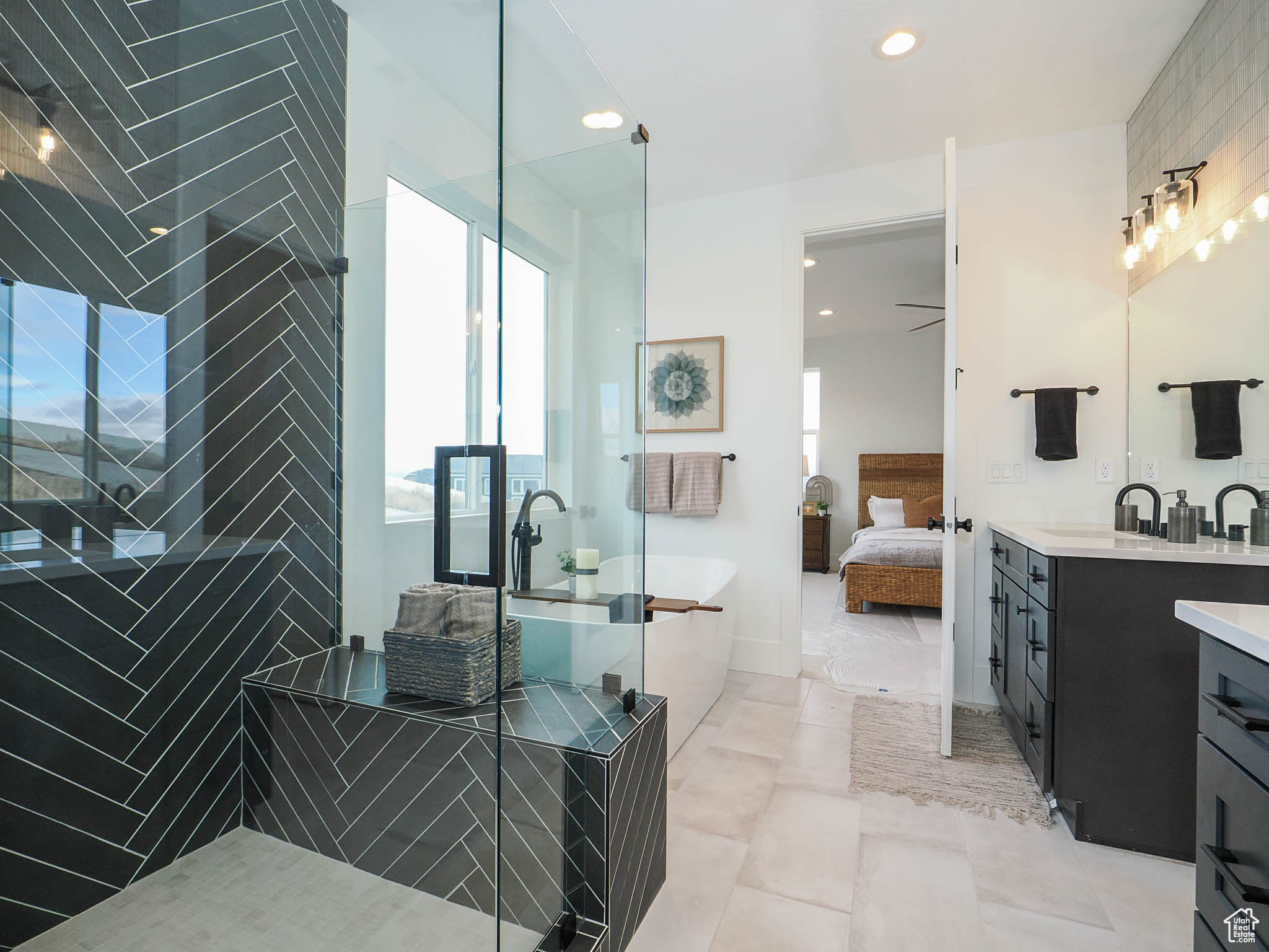 Bathroom featuring vanity, tile floors, and ceiling fan