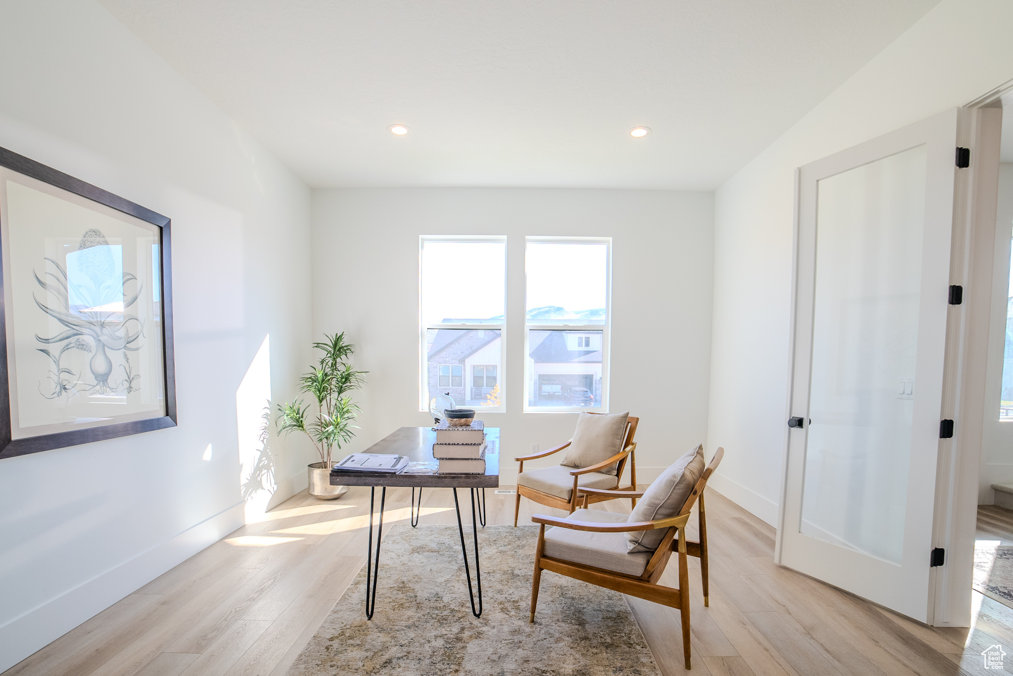 Office with light wood-type flooring