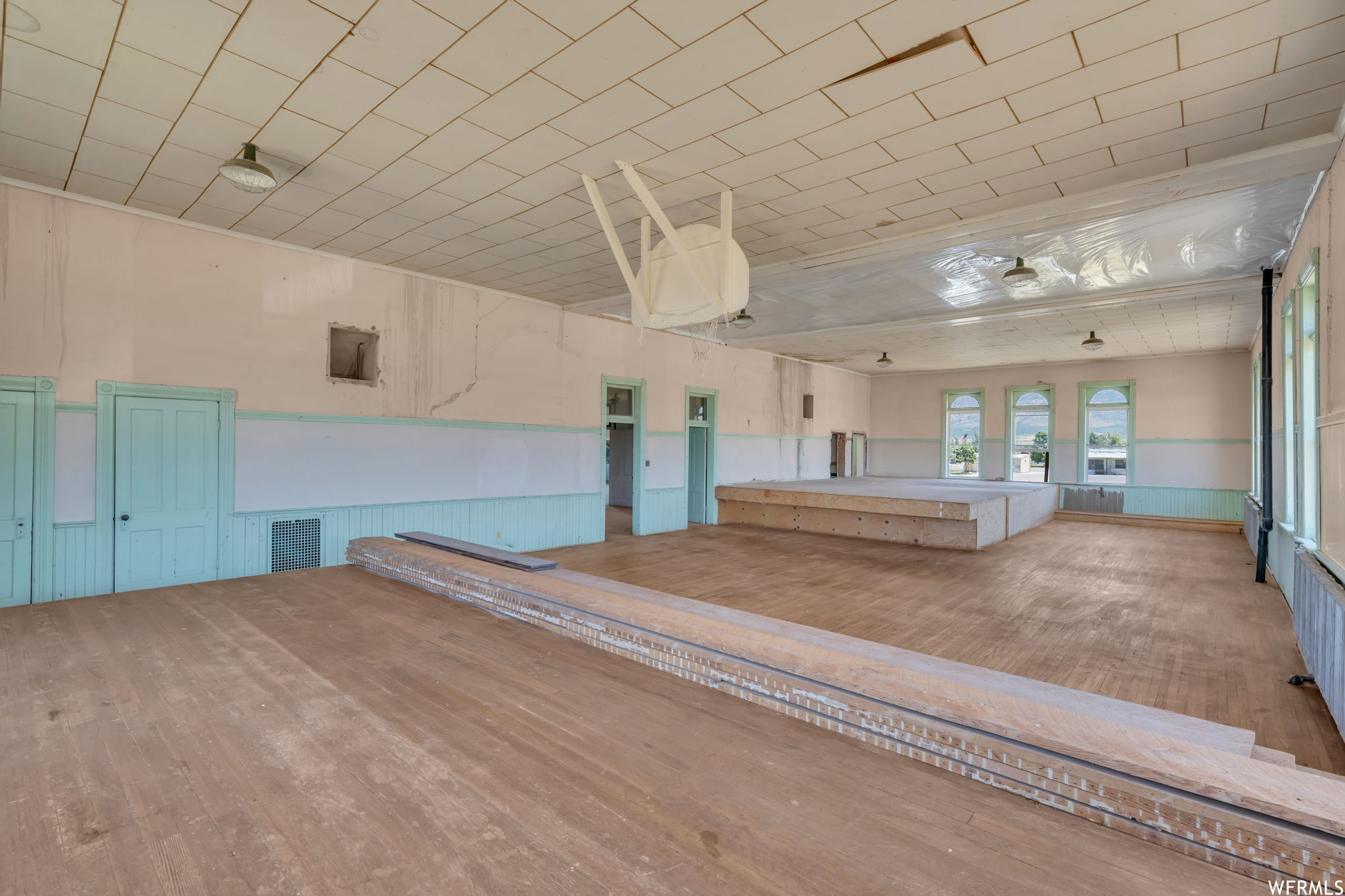 Gymnasium featuring light hardwood flooring