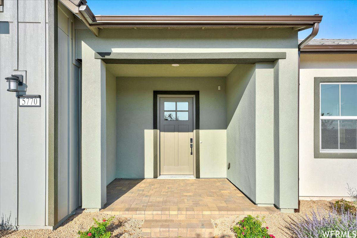 Entrance to property with a patio