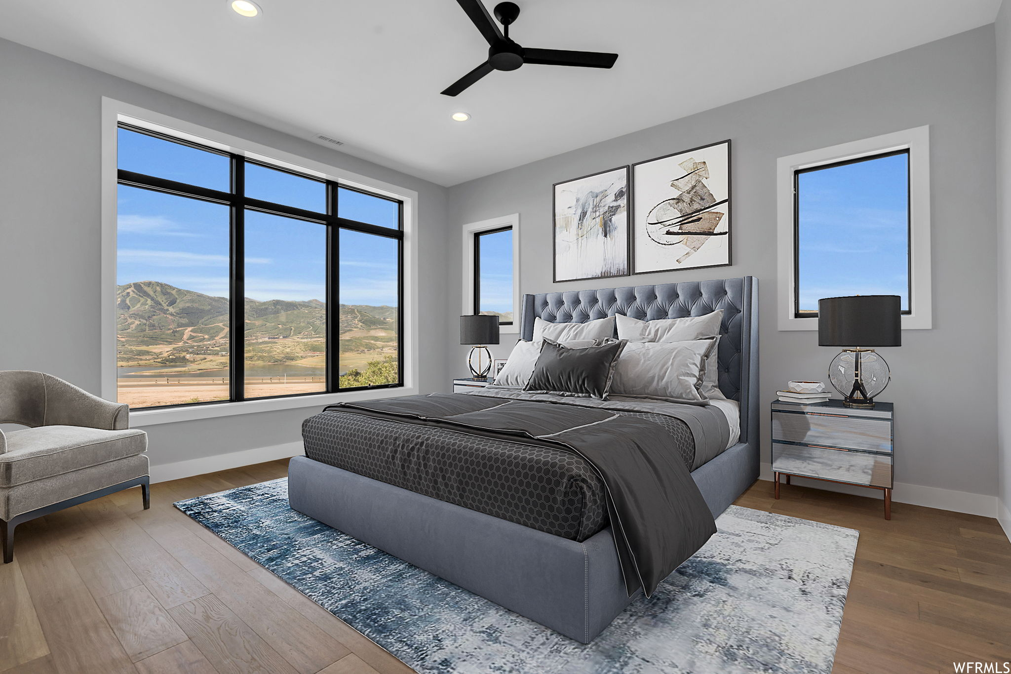 Bedroom featuring ceiling fan and hardwood / wood-style floors. STAGED