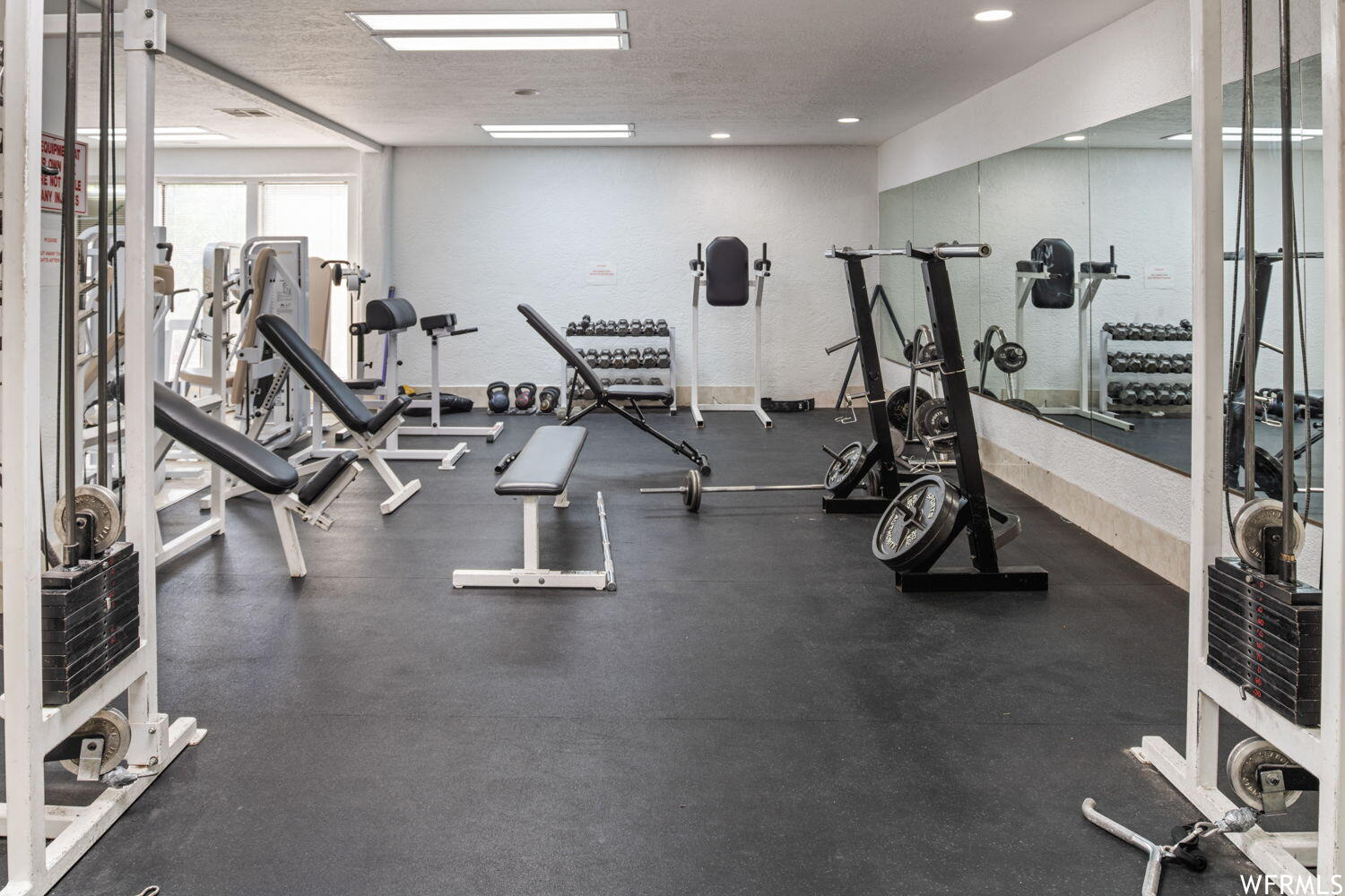 Gym with a textured ceiling