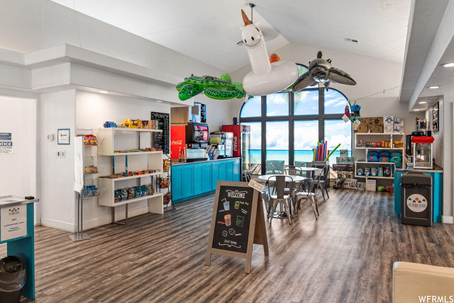 Interior space with a high ceiling and ceiling fan