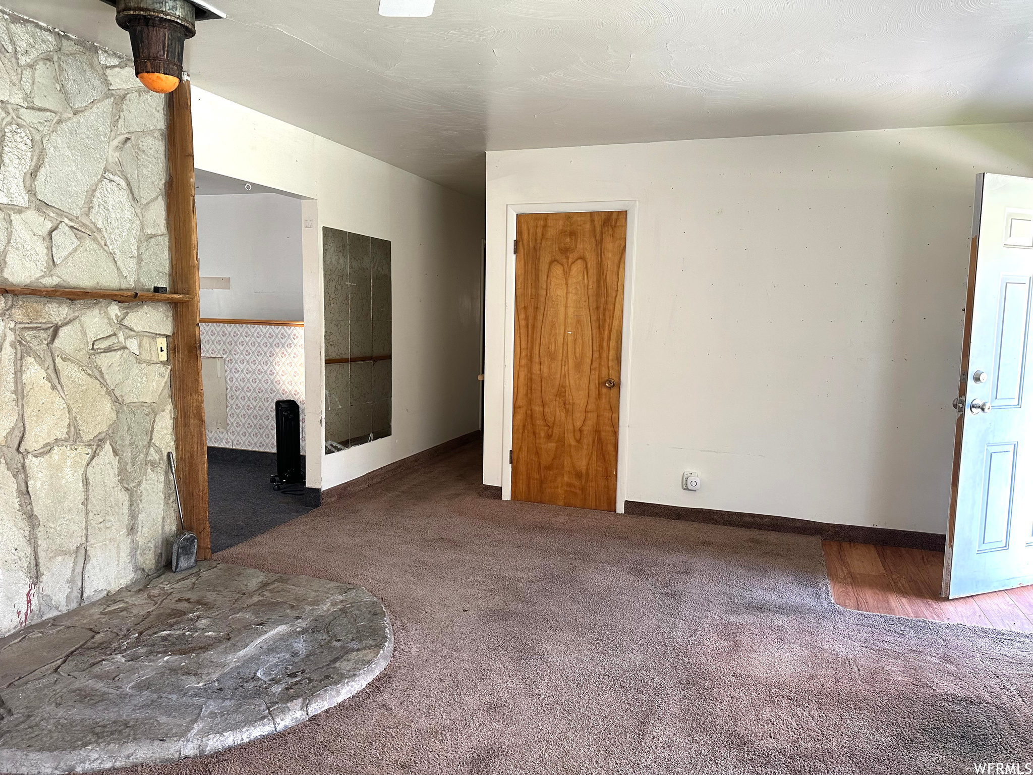 Living room featuring rock mantel