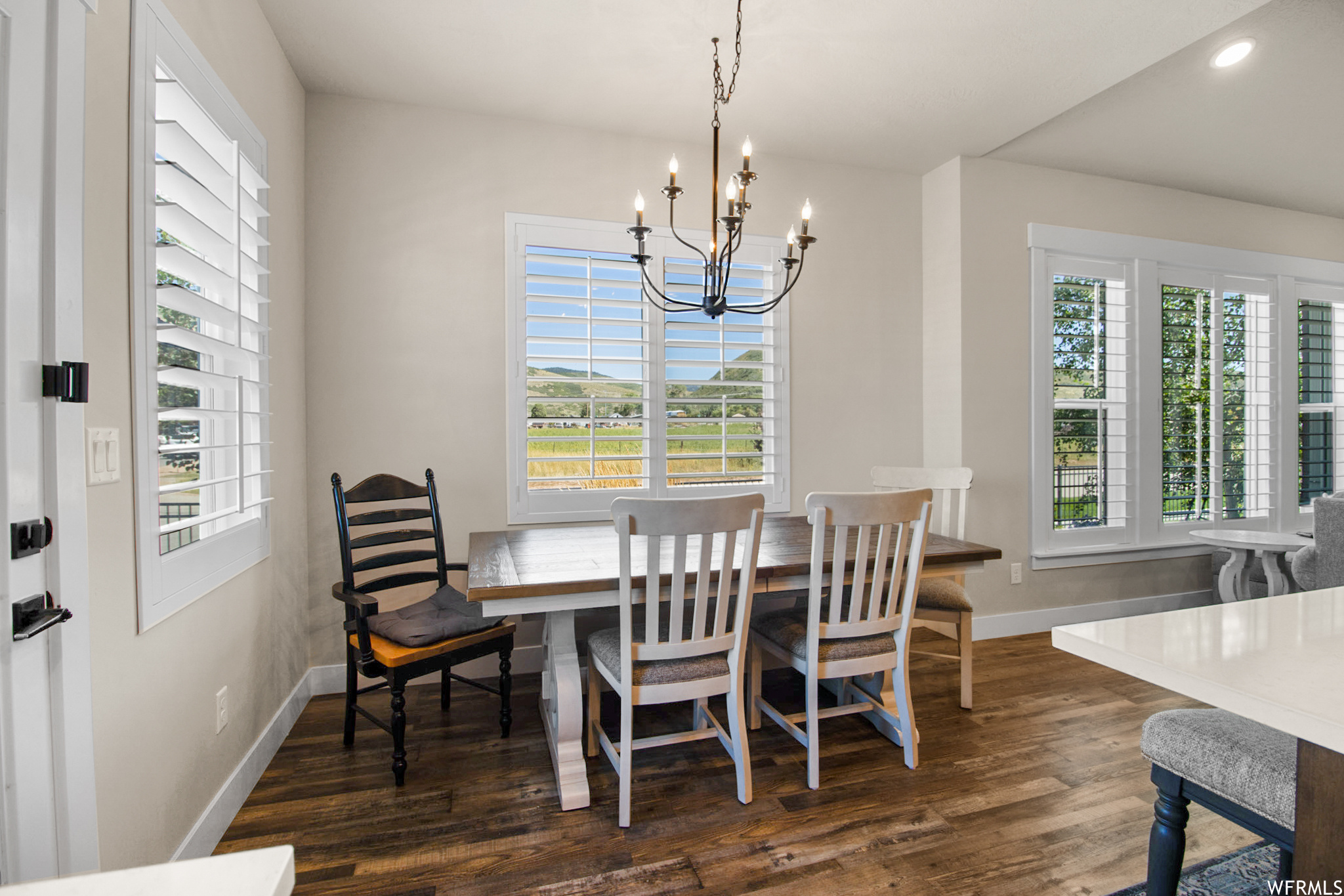 View of wood floored dining space