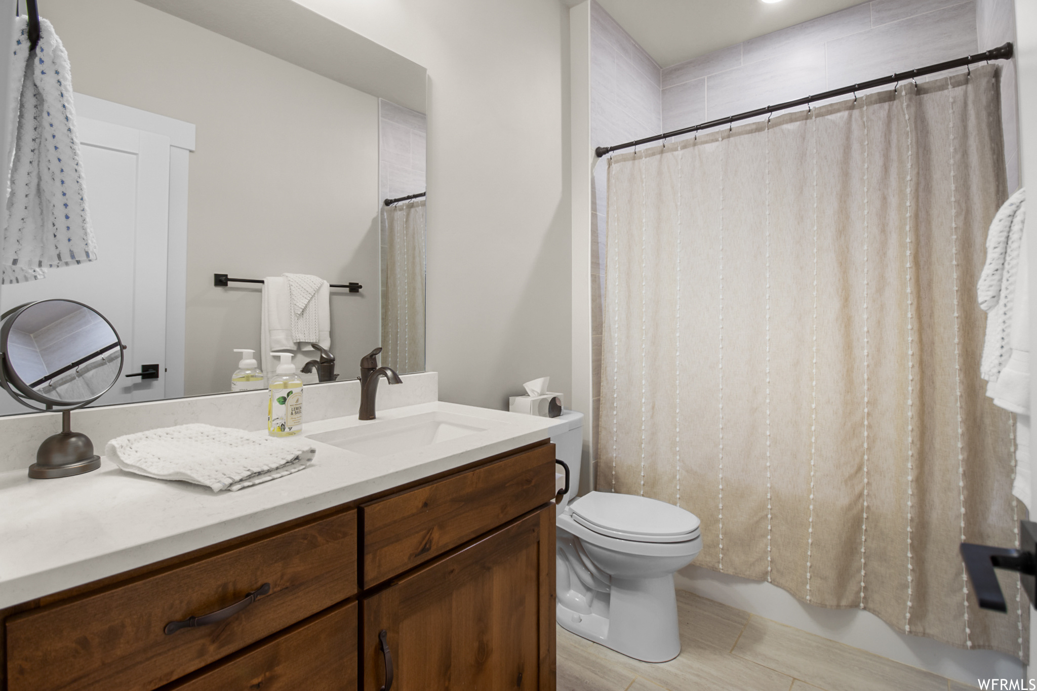 Bathroom with oversized vanity and mirror