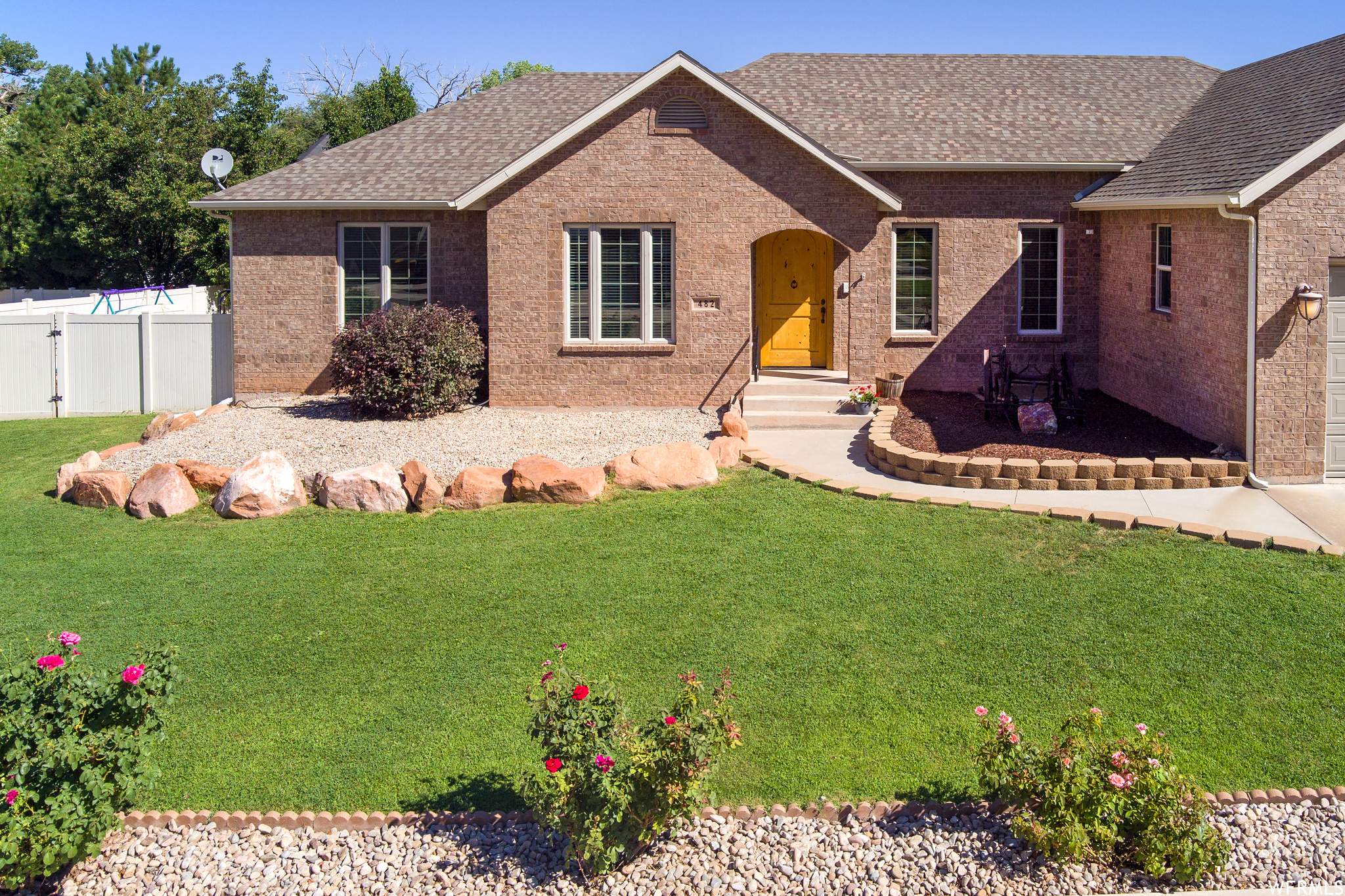 Ranch-style house with a front lawn