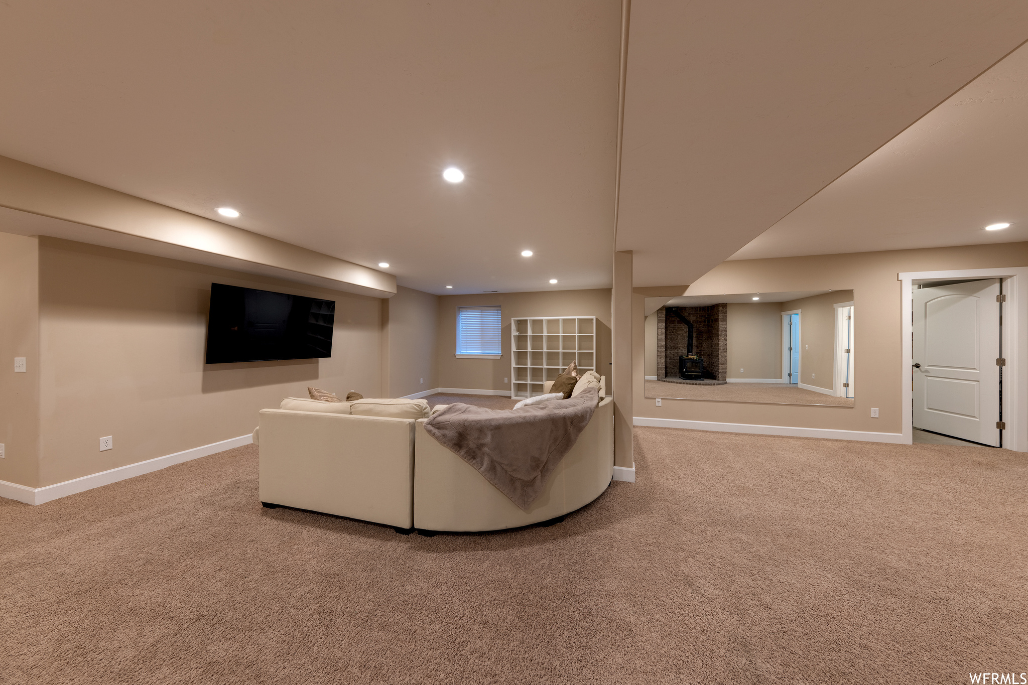 Carpeted living room with a fireplace