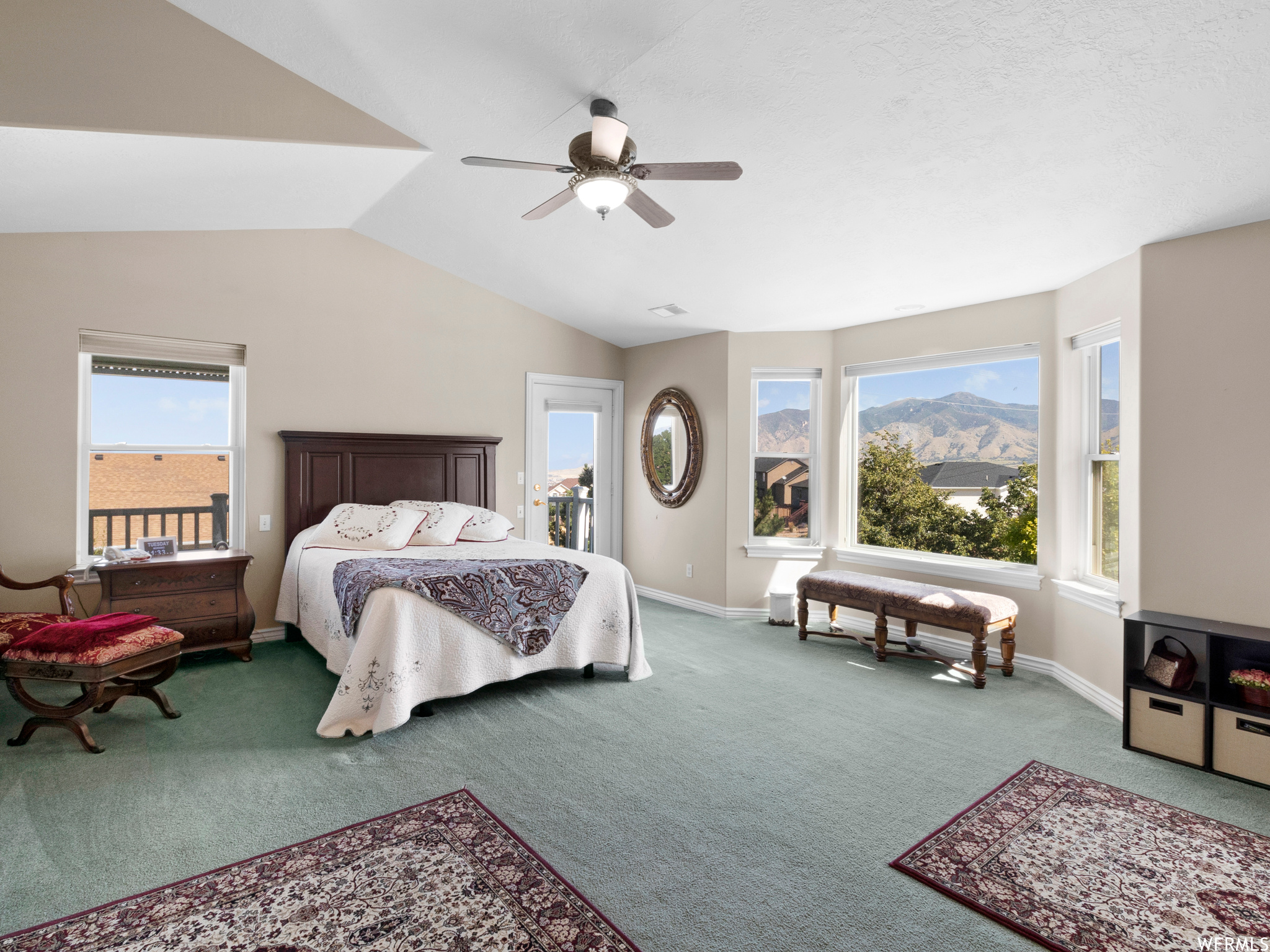 Master Bedroom  vaulted ceiling, balcony and light carpet