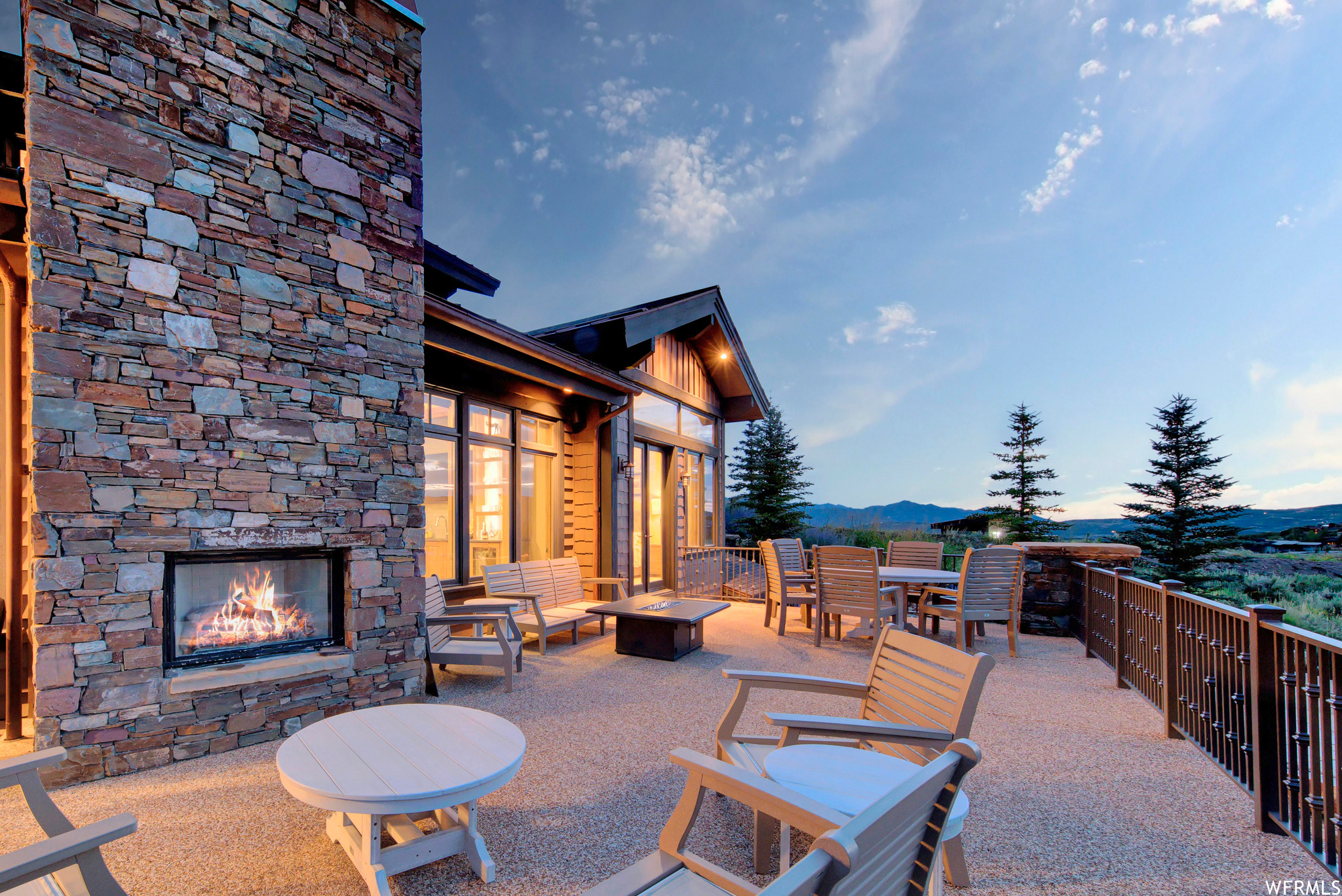 Shady patio / terrace with an outdoor fireplace