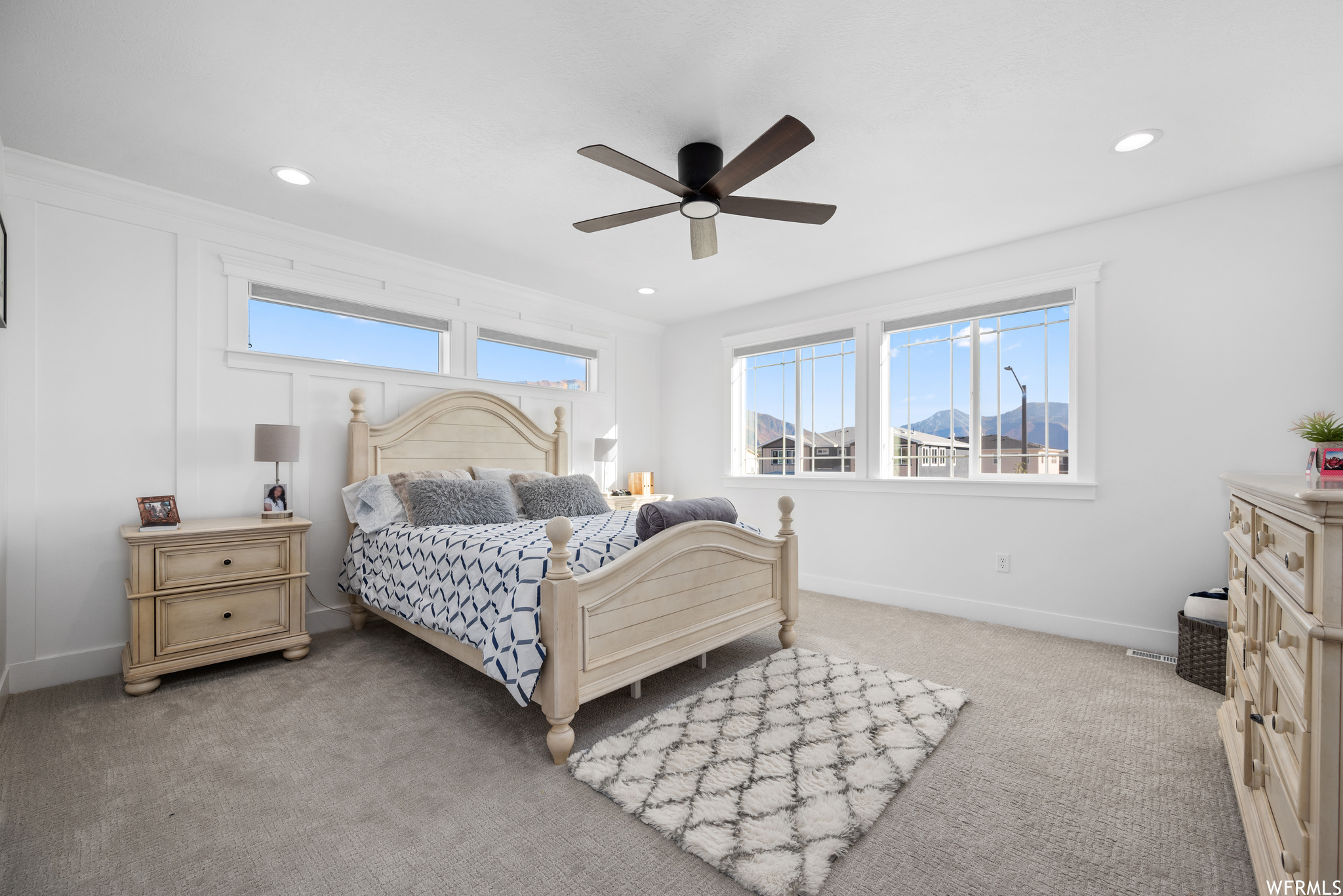 Spacious Master Bedroom with can lighting and ceiling fam.