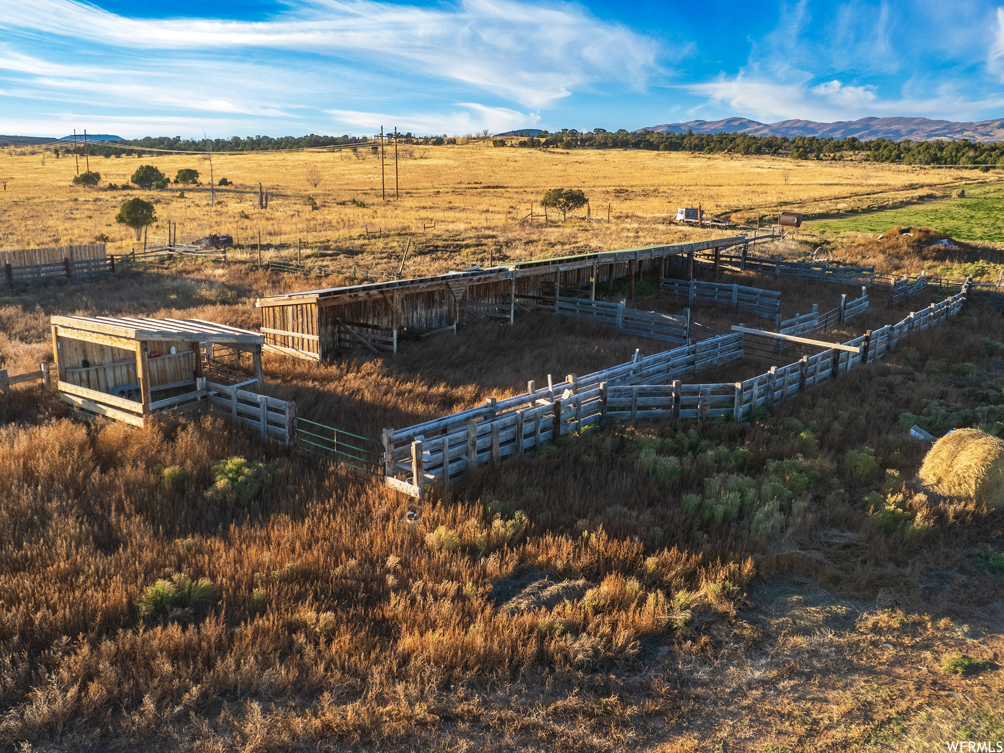 25 YR OWNER FINANCE AVAILABLE: View of horse corral  with a rural view and a mountain view. Includes irrigation water and wheel lines.