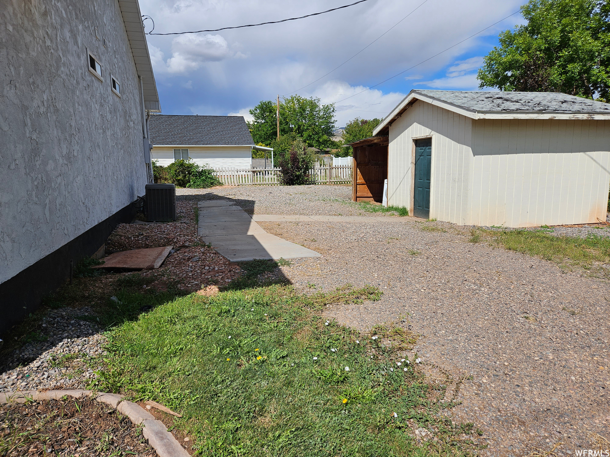 East side driveway and storage shed
