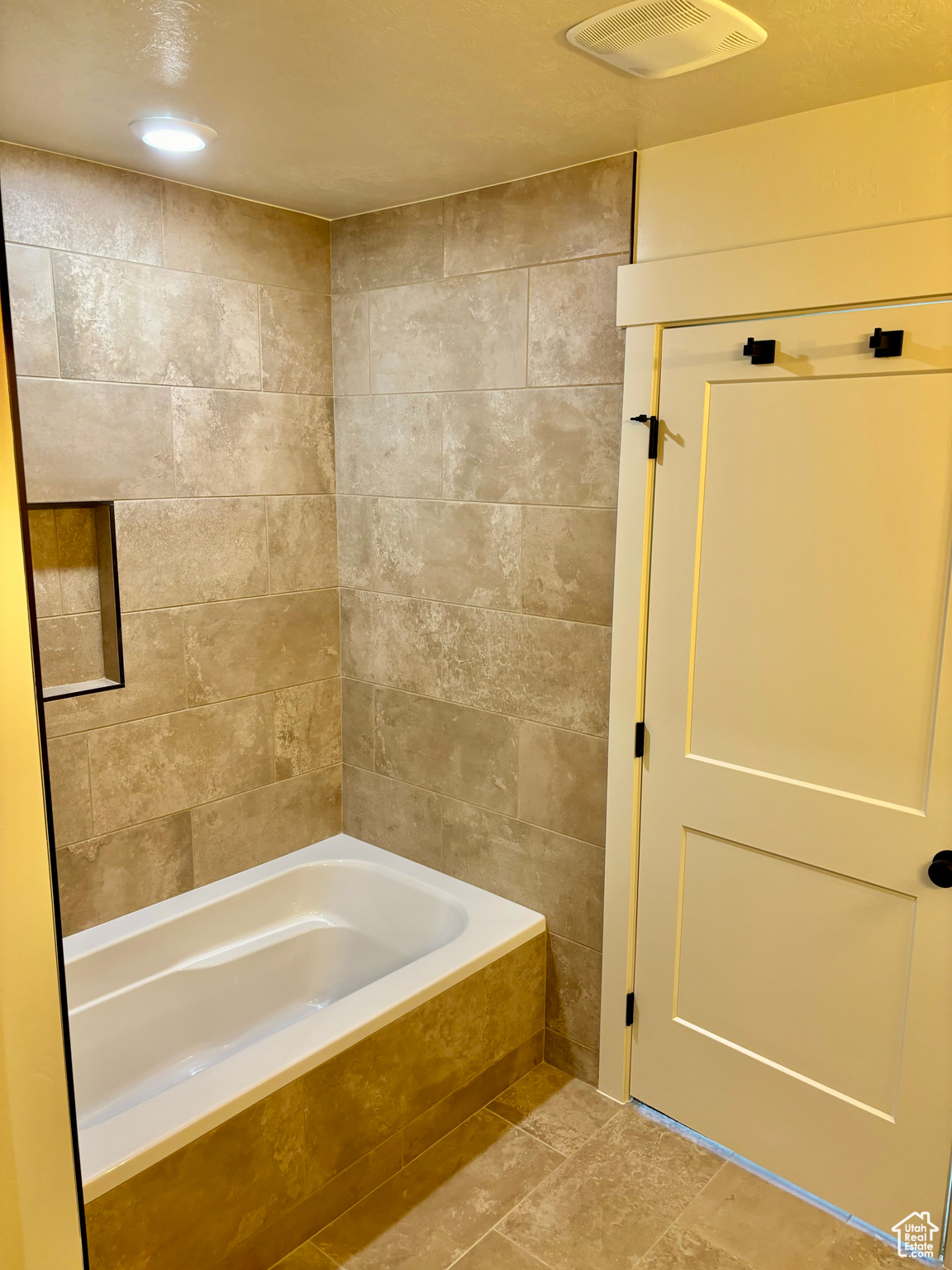 Bathroom with tile patterned floors