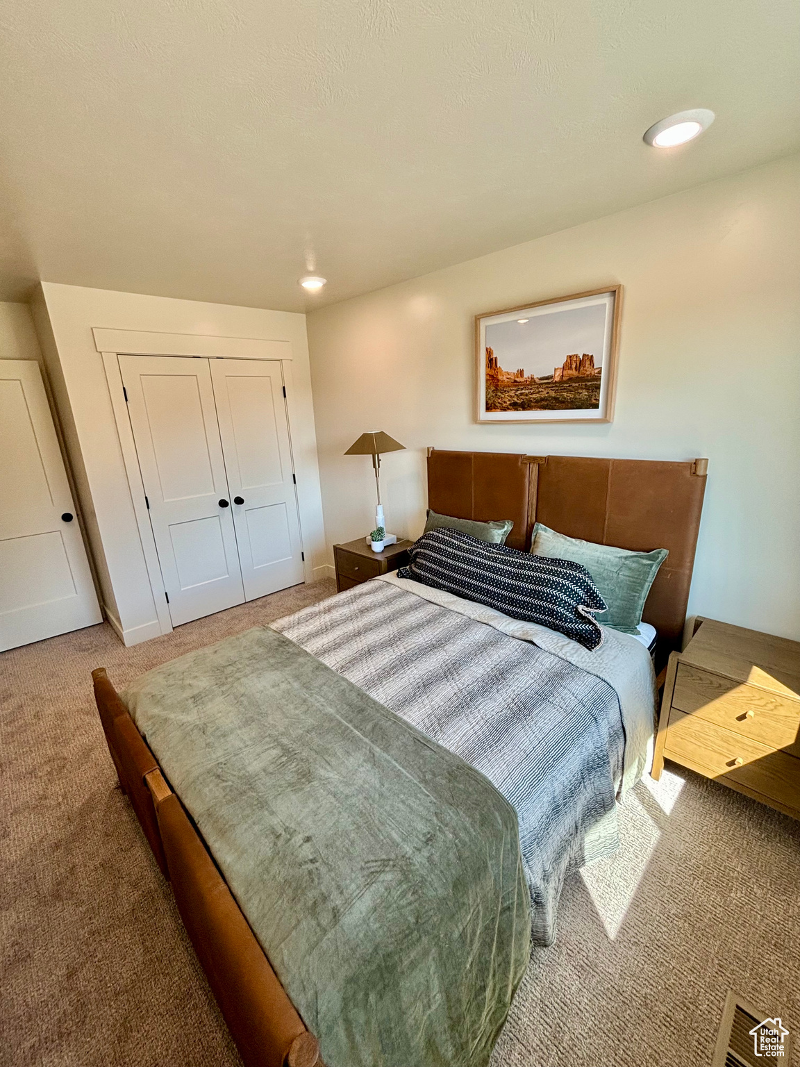 Bedroom with a closet and carpet flooring